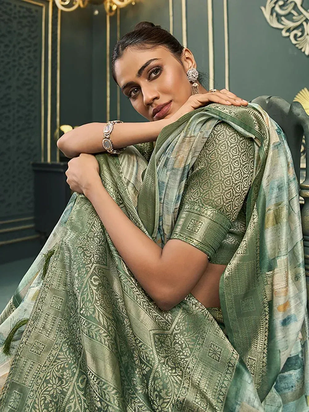 Elegant green printed saree with intricate patterns, perfect for Indian ethnic wear occasions.