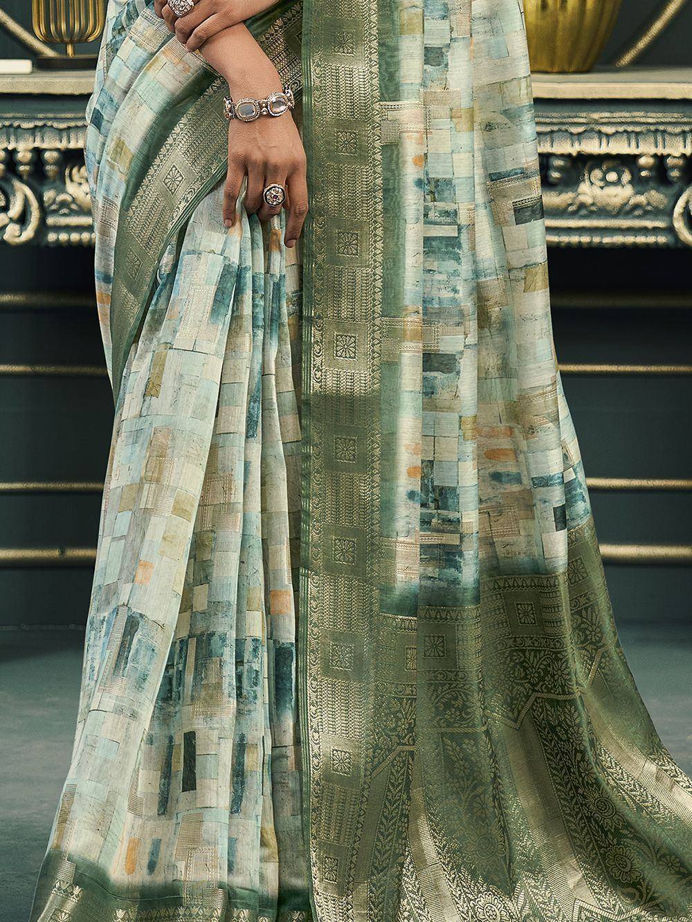 Elegant green and blue patchwork saree with intricate border, perfect for ethnic occasions