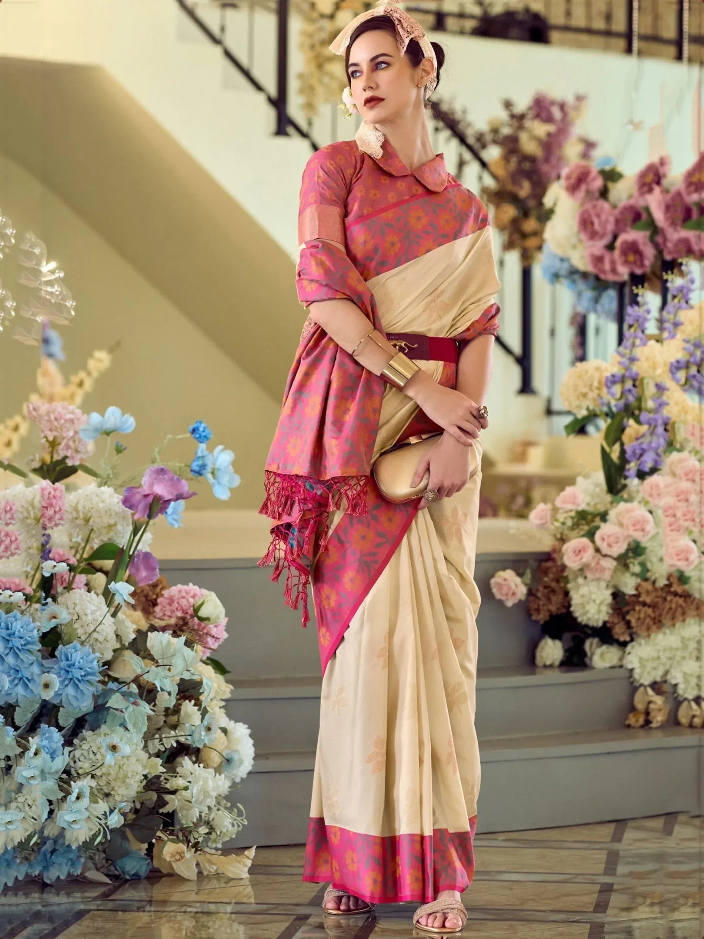 Woman in elegant pink and beige floral saree with lace blouse, perfect for Indian ethnic occasions