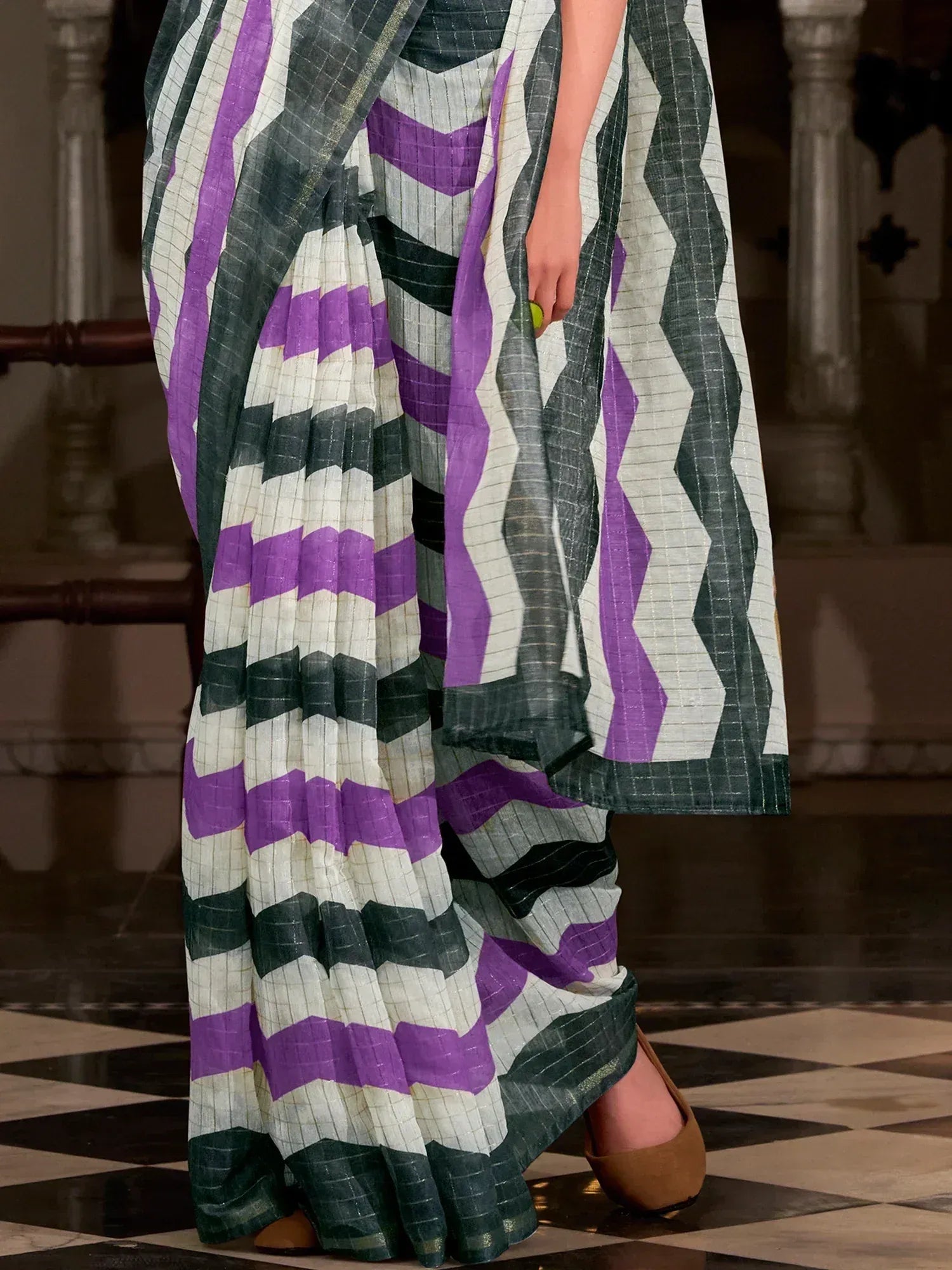 Purple and green geometric patterned saree with pleated design, styled for ethnic wear