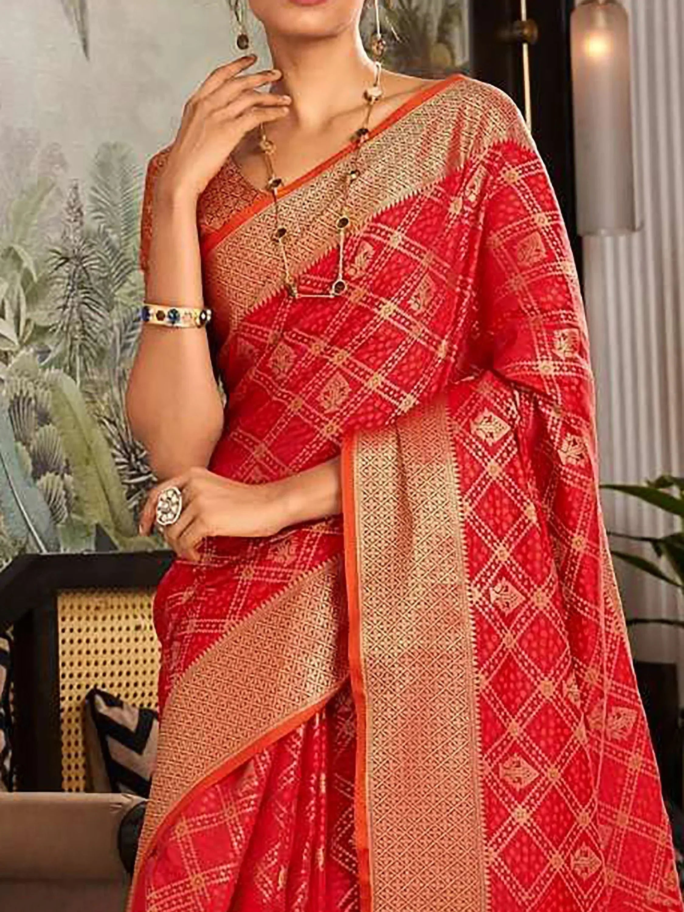 Red and gold ethnic saree with geometric print, perfect for Indian occasions and festive wear
