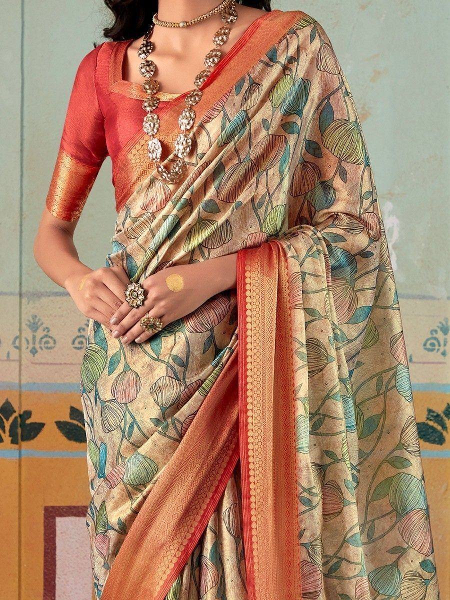 Floral print saree with orange border and matching blouse, styled with traditional jewelry for ethnic wear