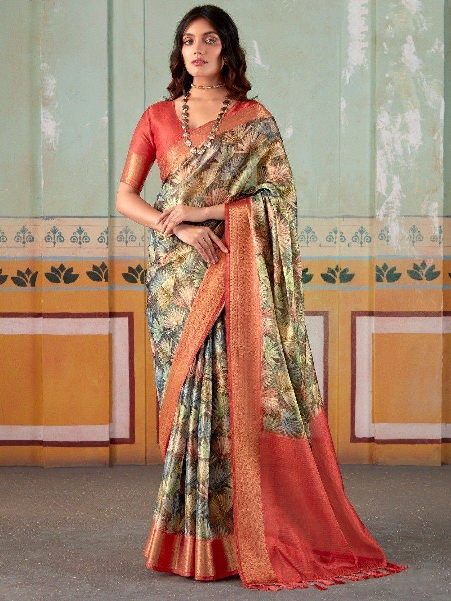 Woman wearing floral print saree with orange border, Indian ethnic wear for festive occasions