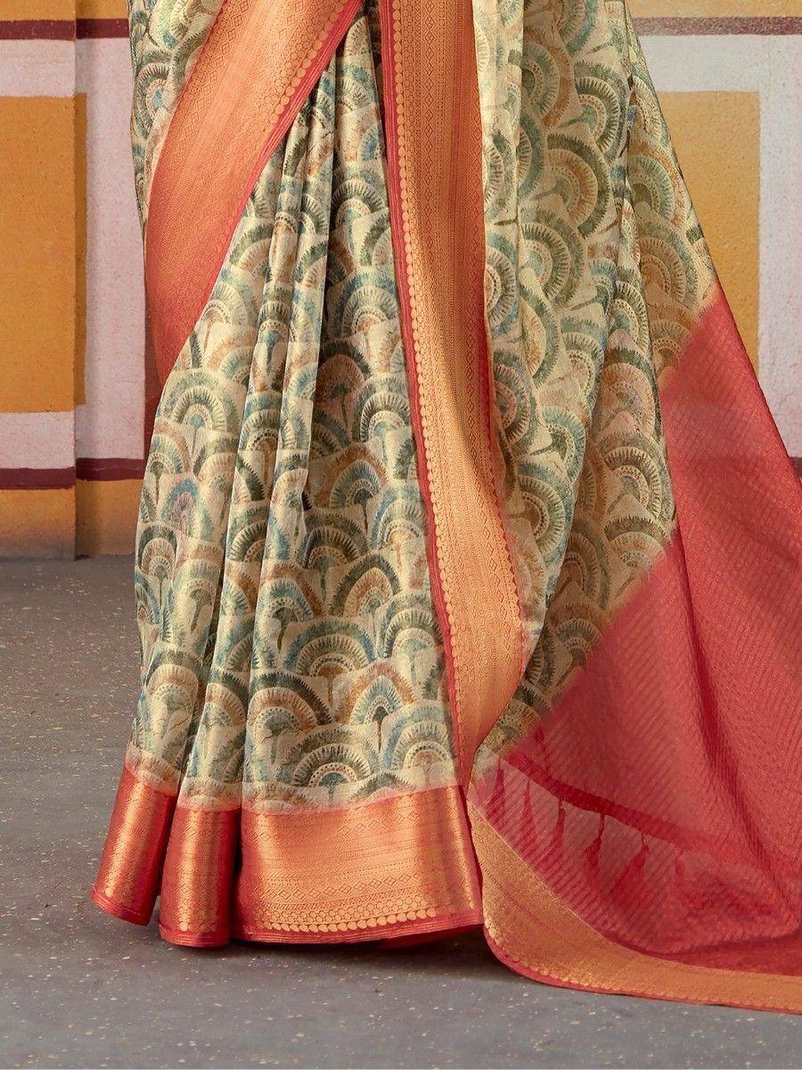 Elegant Indian saree with peacock feather print and orange border, perfect for ethnic occasions