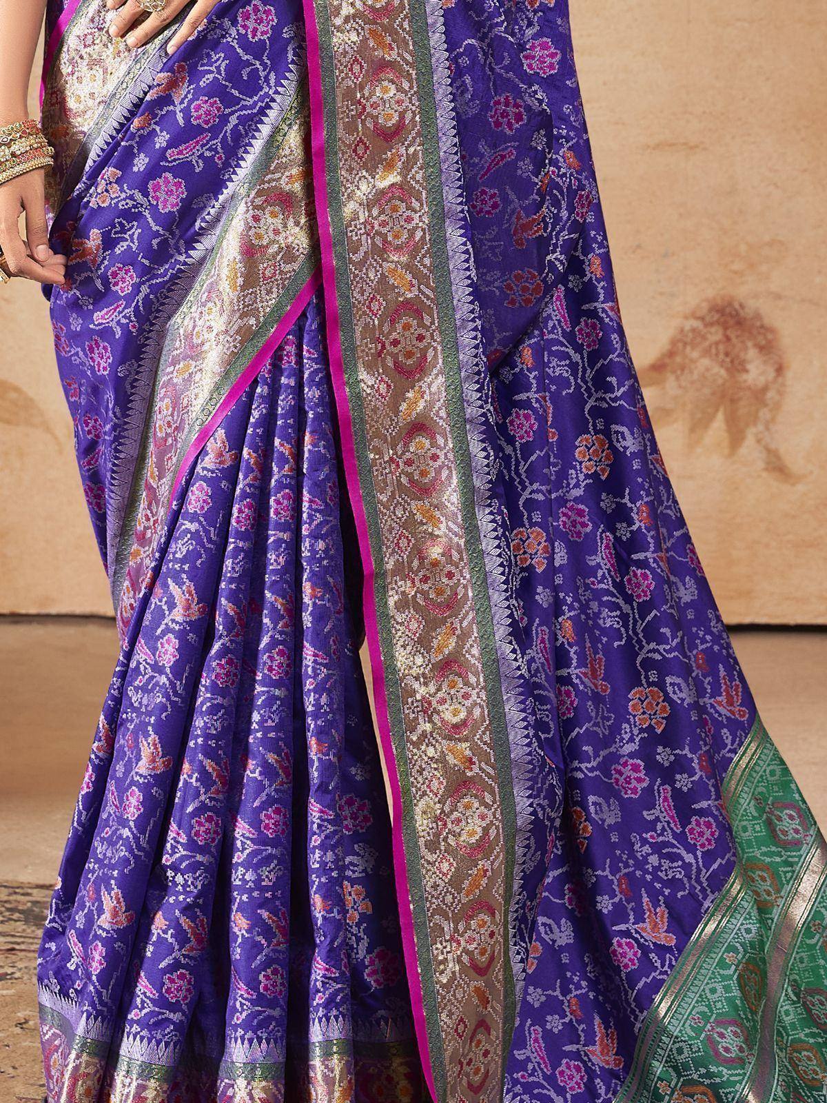 Purple floral printed saree with intricate gold and pink border, ethnic Indian wear