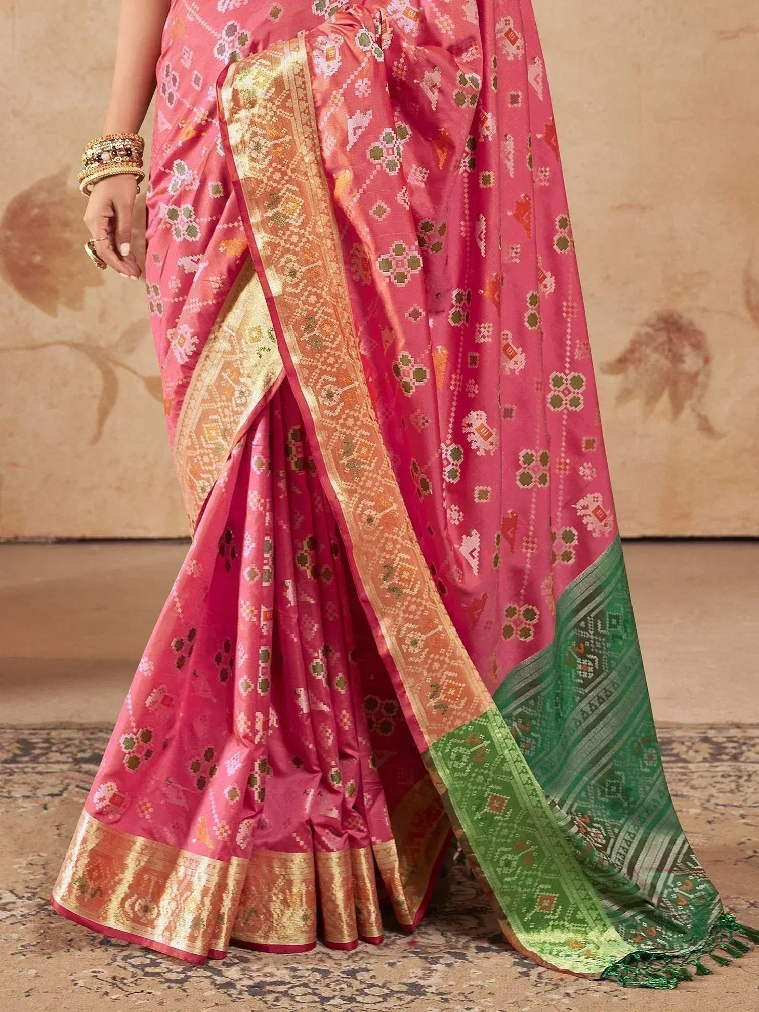Pink ethnic saree with gold border and green pallu, designer Indian wear for festive occasions