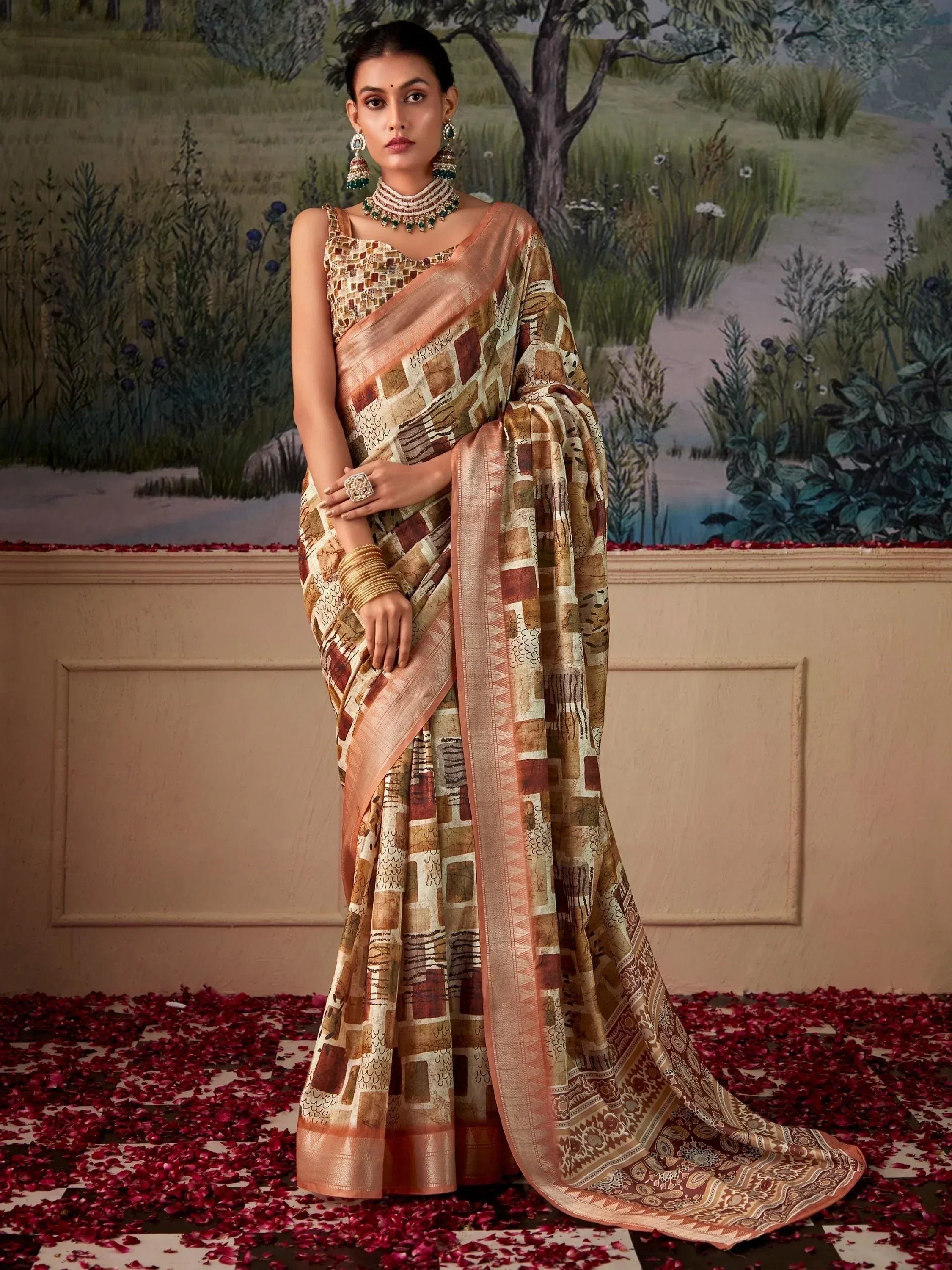 Elegant woman in designer saree with geometric print, traditional jewelry, standing on rose petals