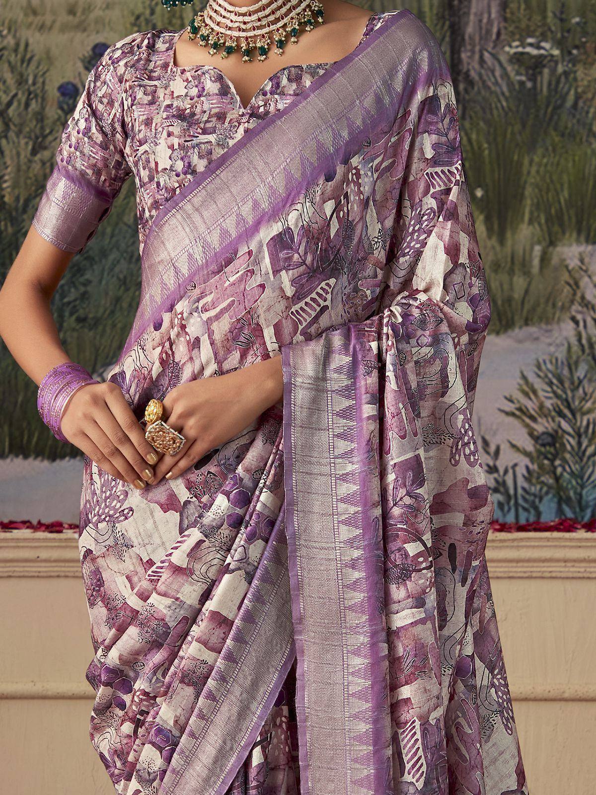Purple printed saree with floral pattern, ethnic blouse, and traditional jewelry for Indian occasions