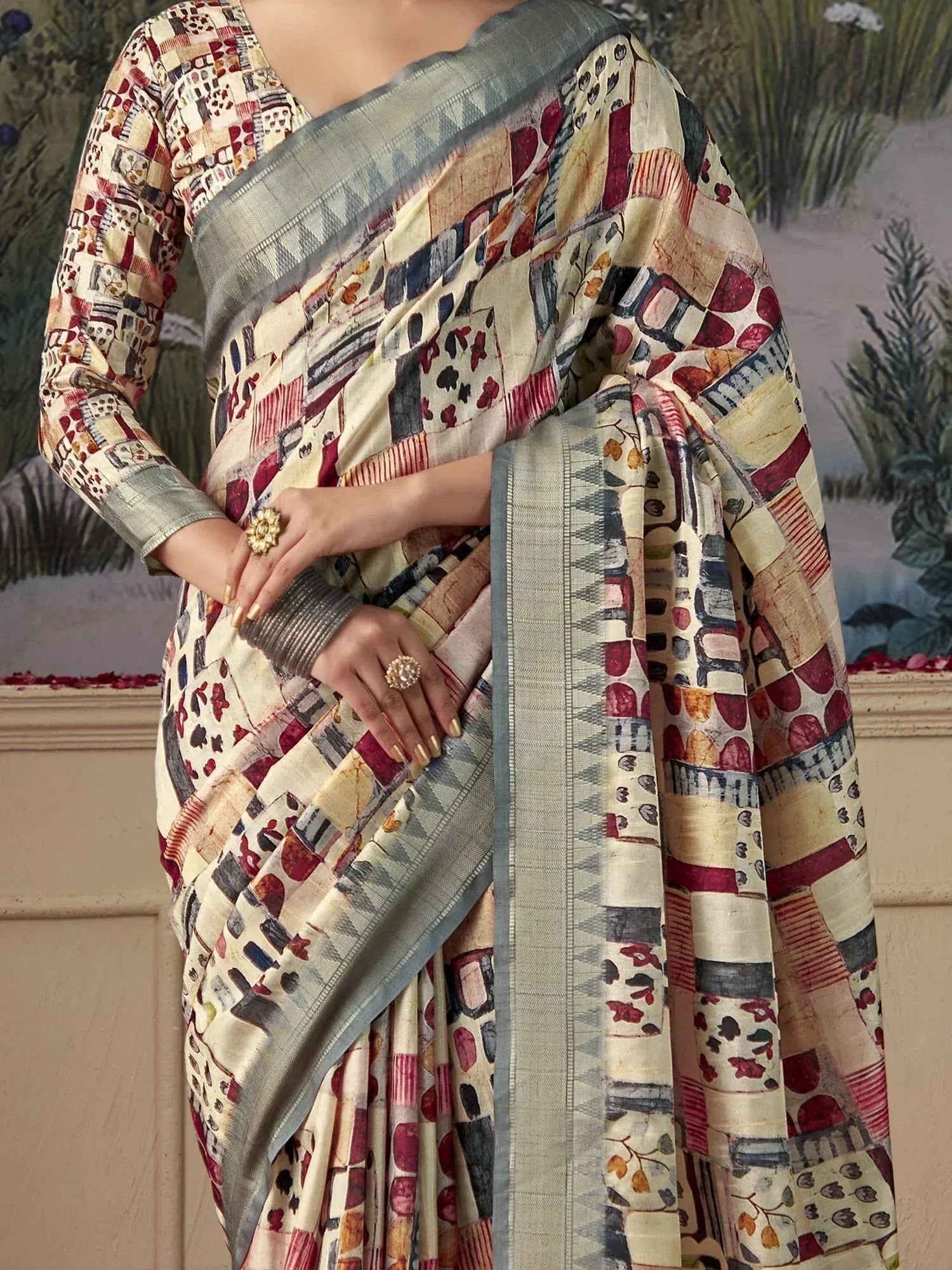 Stylish printed saree with geometric floral pattern, grey border, and matching blouse for ethnic wear