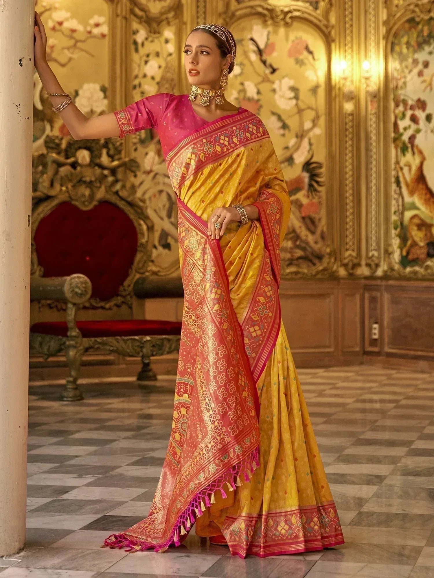 Elegant yellow and pink designer saree with intricate embroidery, perfect for Indian ethnic wear occasions.