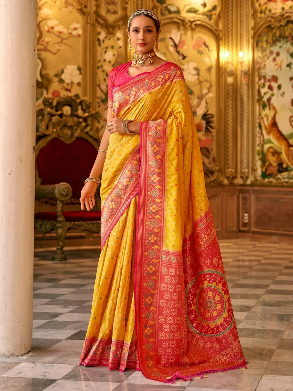 Yellow and pink designer saree with intricate embroidery, perfect for Indian ethnic wear occasions.