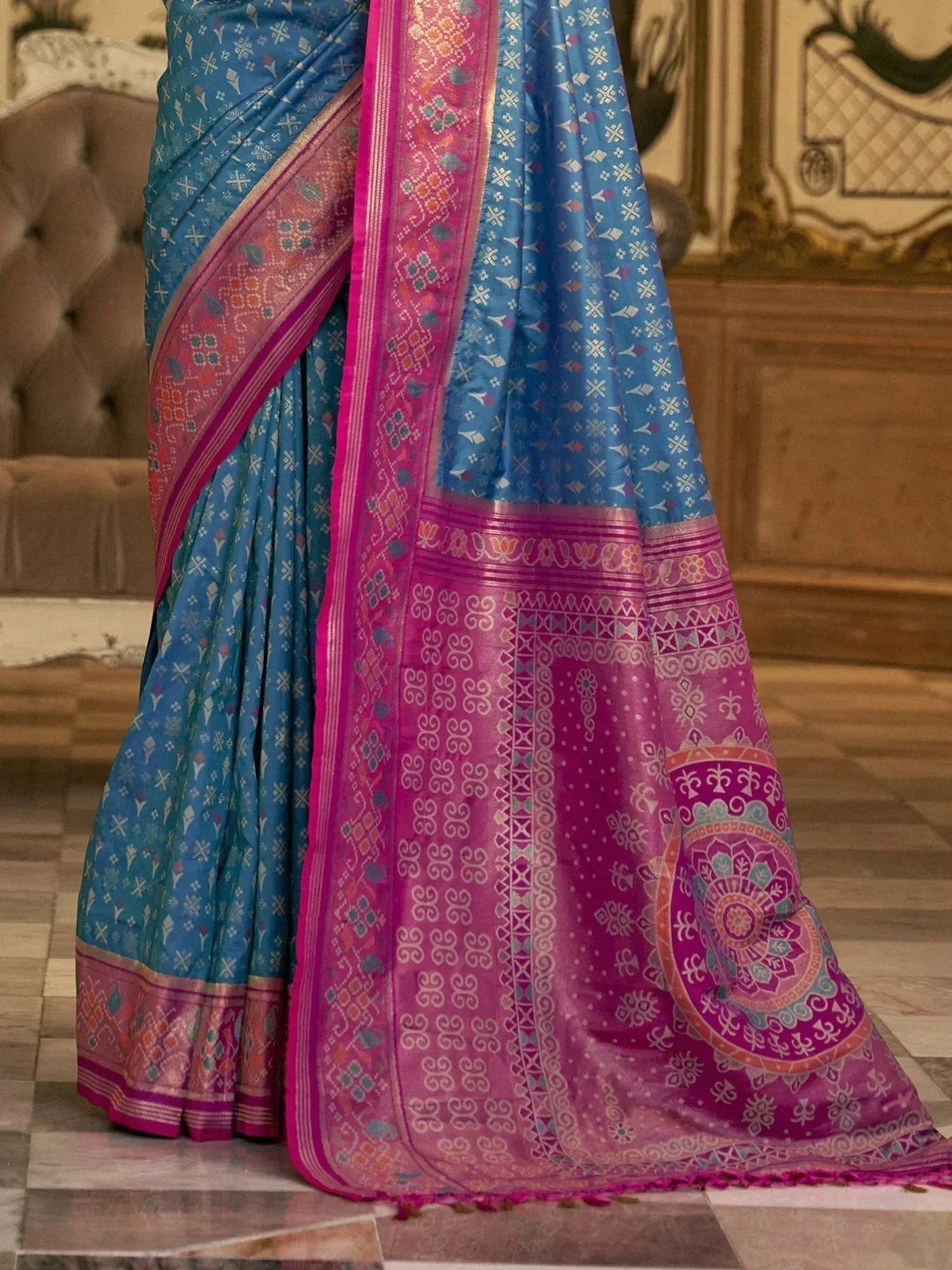 Blue and pink designer saree with intricate floral and geometric patterns, perfect for ethnic wear occasions