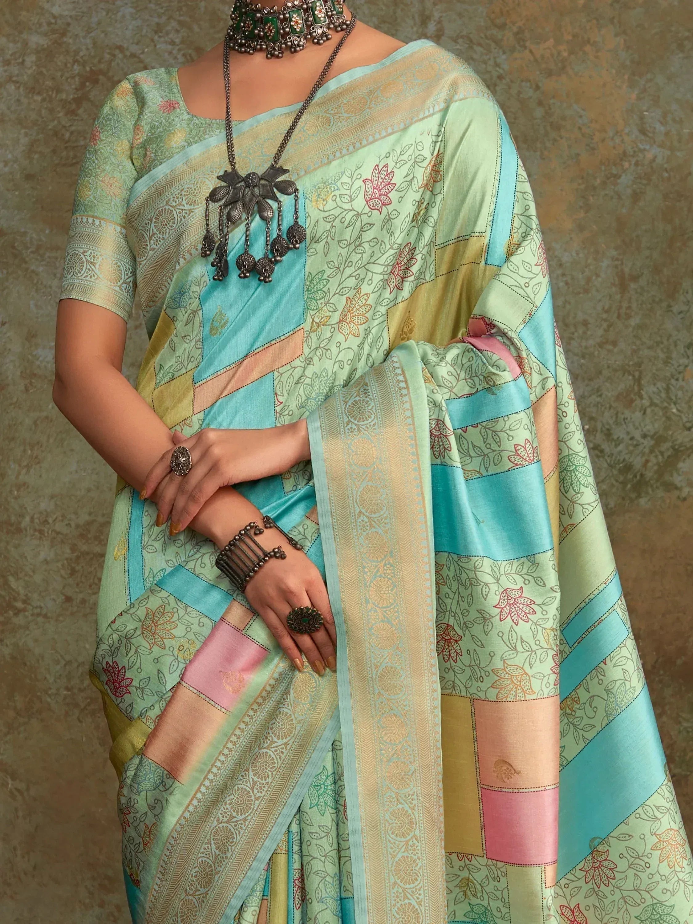 Mint green floral saree with patchwork design, ethnic jewelry, perfect for Indian occasions