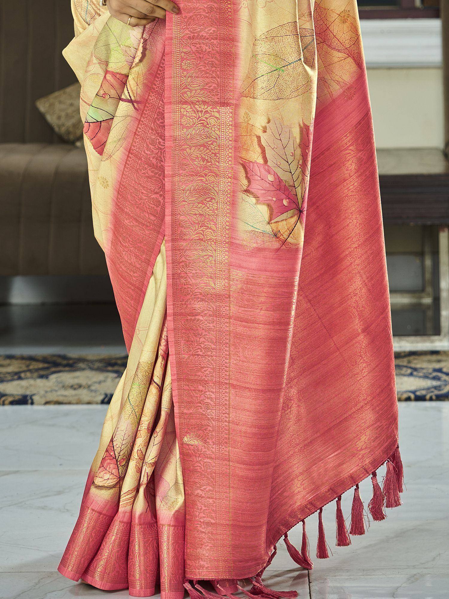 Pink and gold leaf-print saree with intricate border and tassels, ideal for ethnic occasions