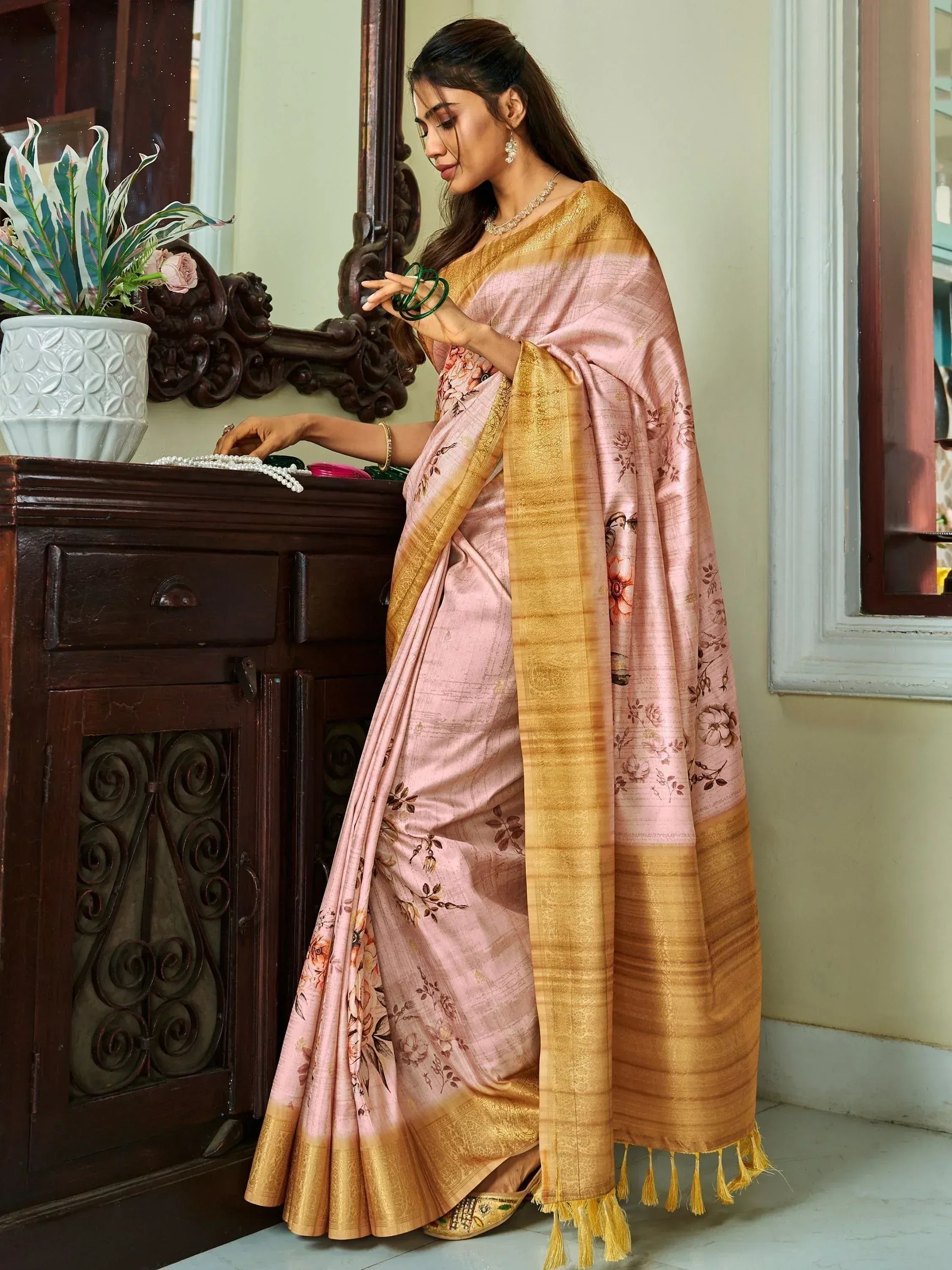 Elegant pink floral saree with golden border, perfect for Indian ethnic occasions