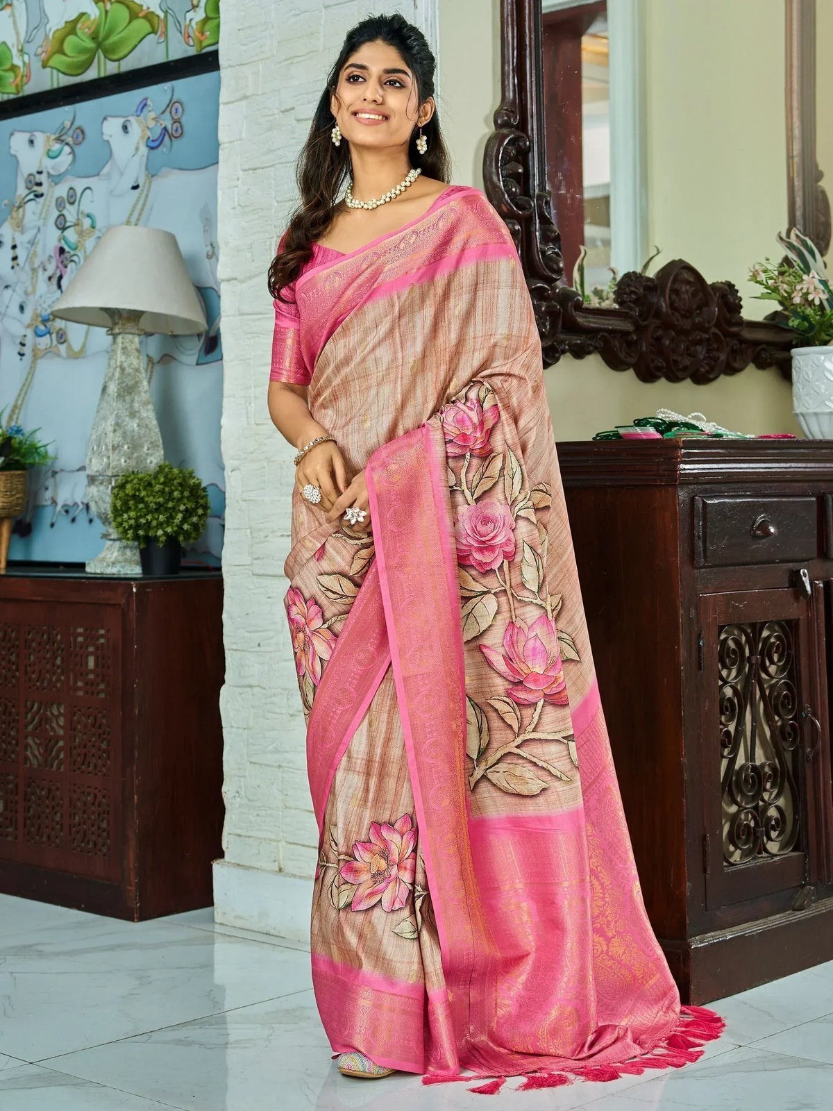 Elegant pink floral saree with designer embroidery, perfect for Indian ethnic wear occasions.