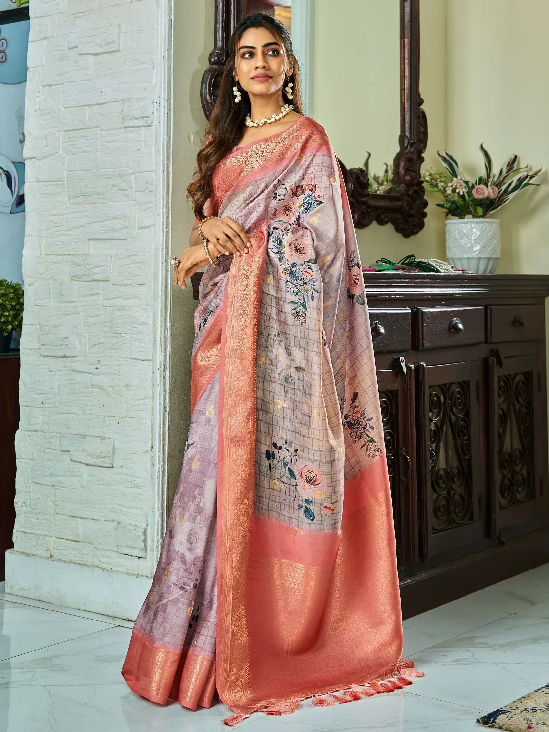Elegant floral saree with peach border, perfect for Indian ethnic wear occasions