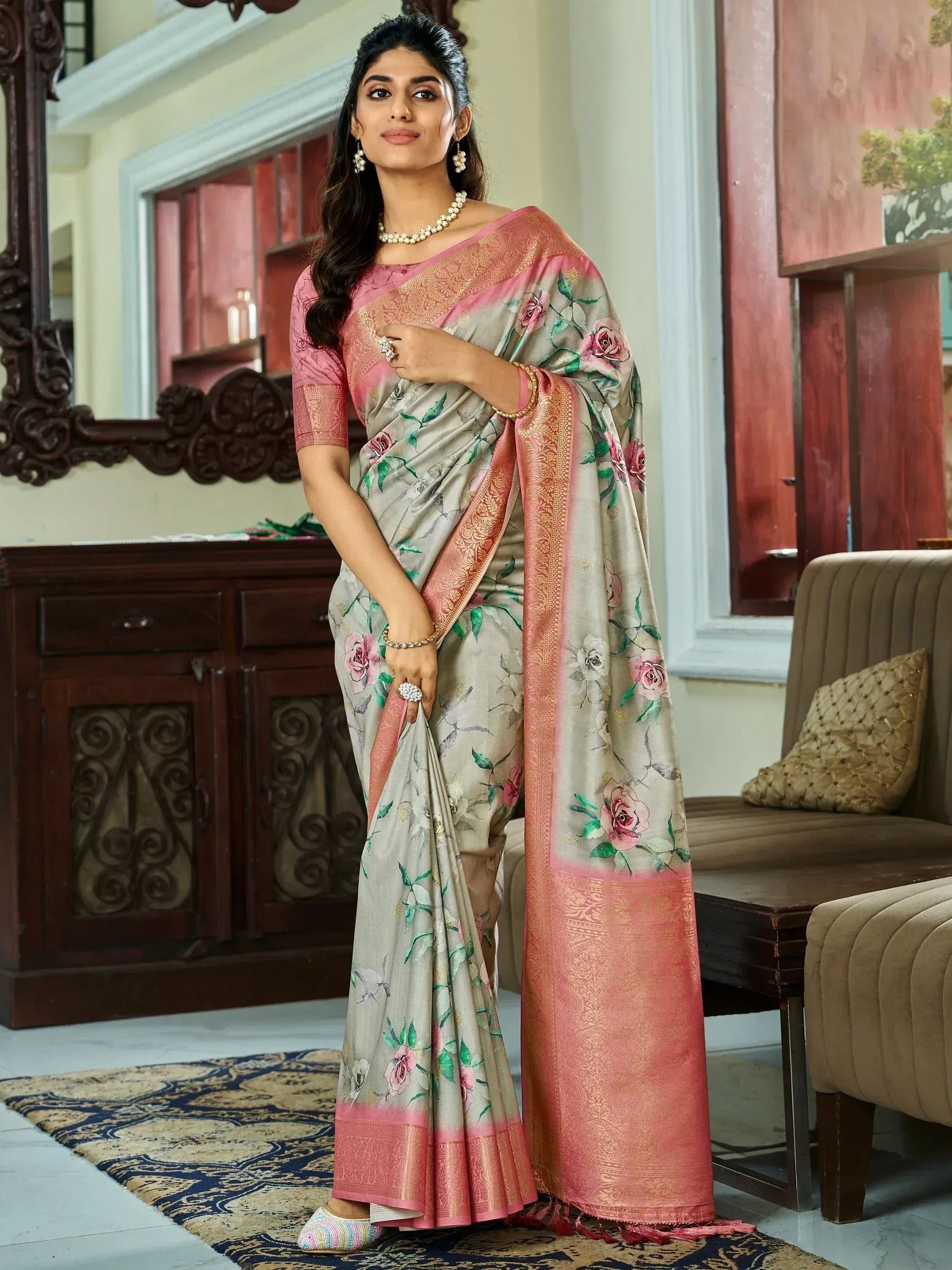 Elegant floral print saree with pink border, perfect for Indian ethnic wear occasions.