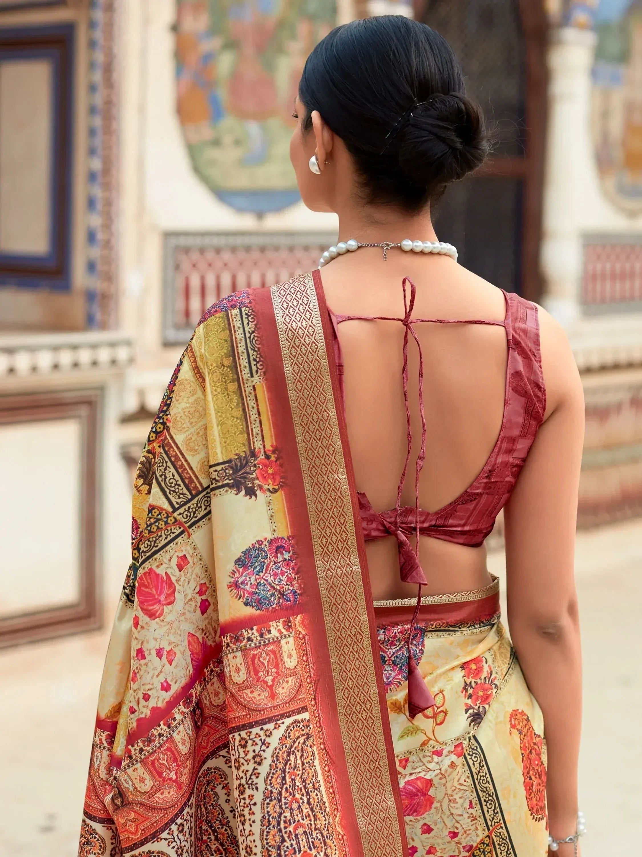 Elegant Indian saree with floral print and open back blouse, perfect for ethnic occasions.