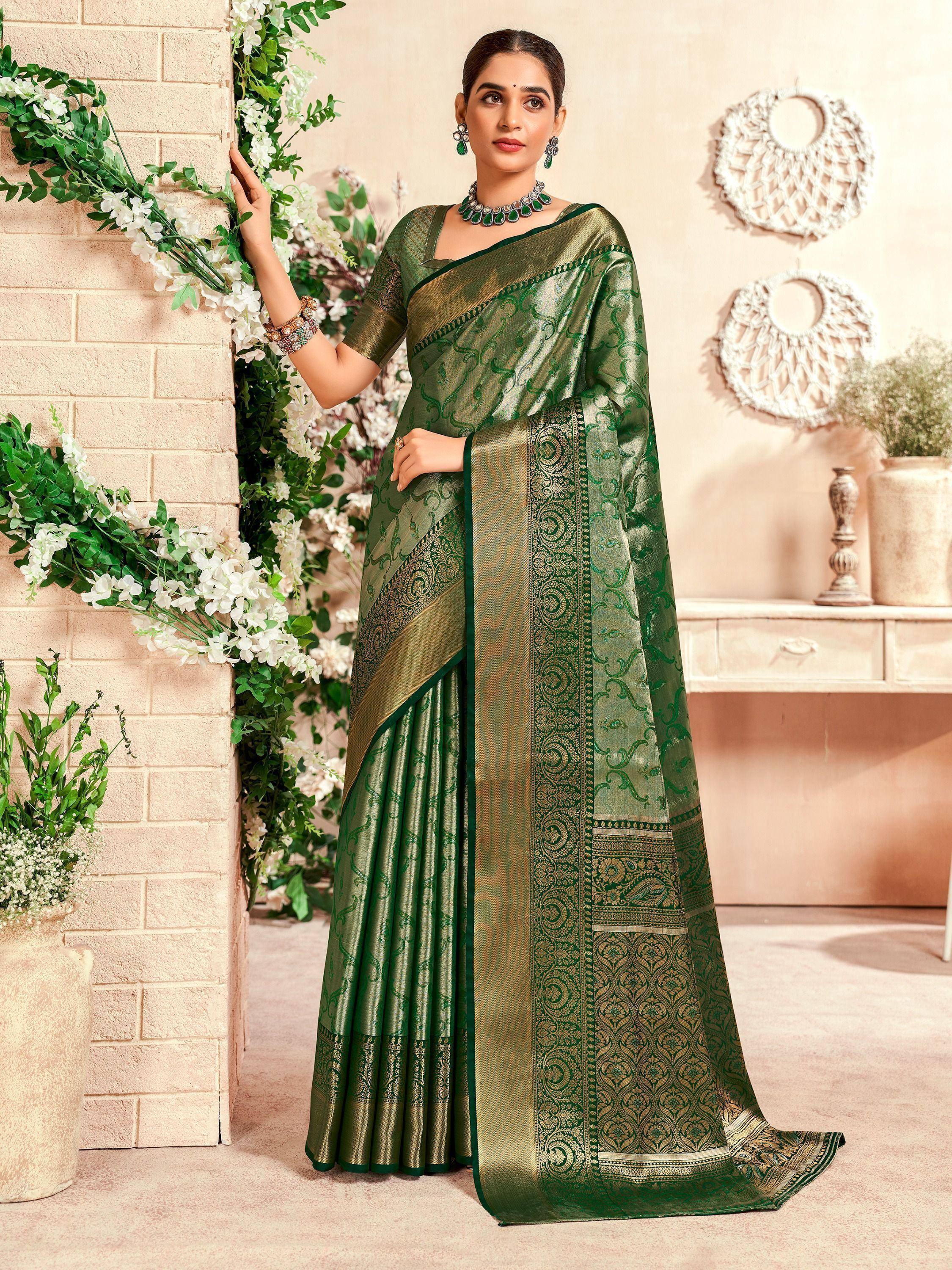 Elegant green designer saree with gold embroidery, perfect for Indian ethnic wear occasions.