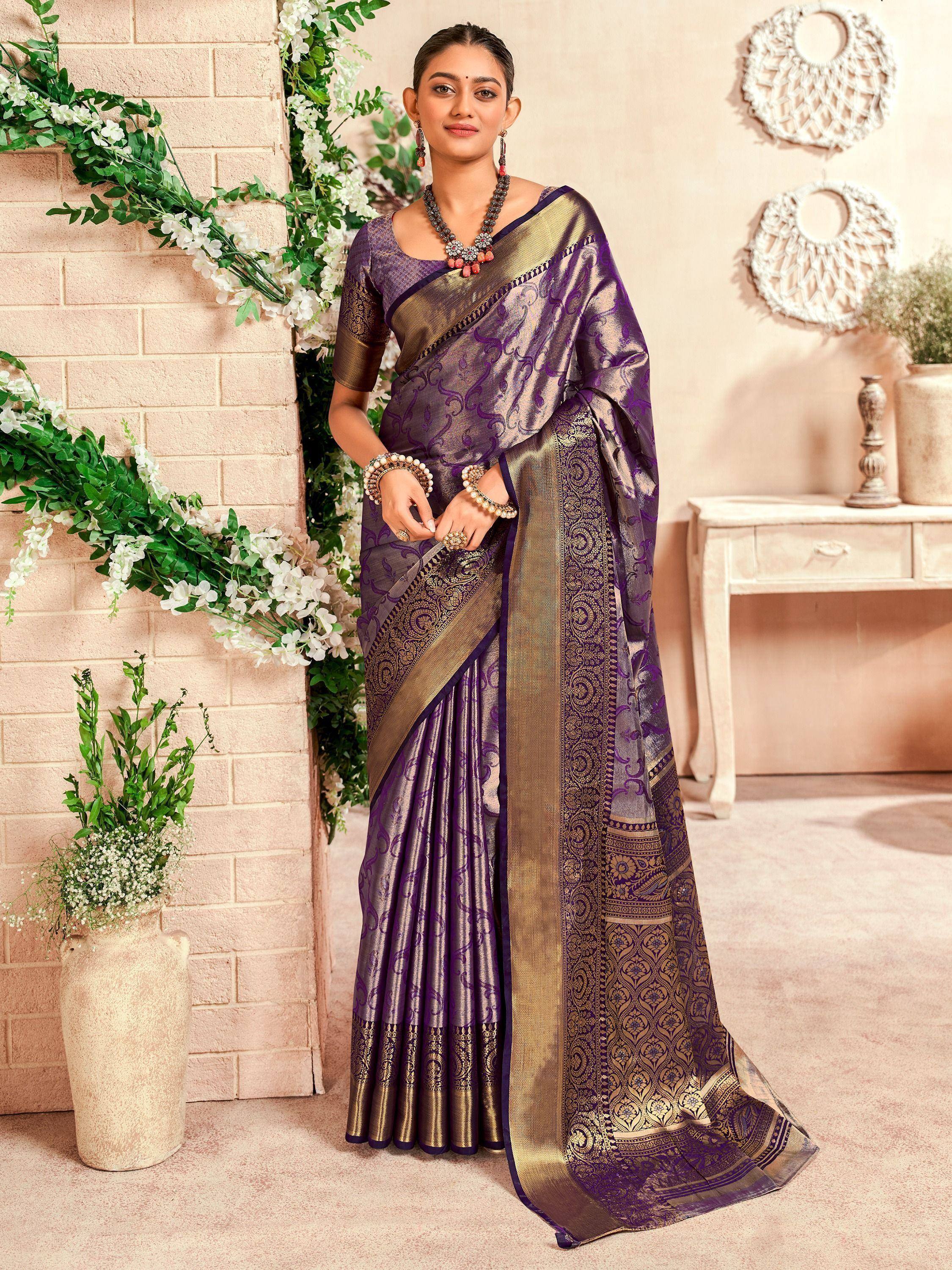 Elegant purple and gold designer saree with intricate patterns, perfect for Indian ethnic wear occasions.