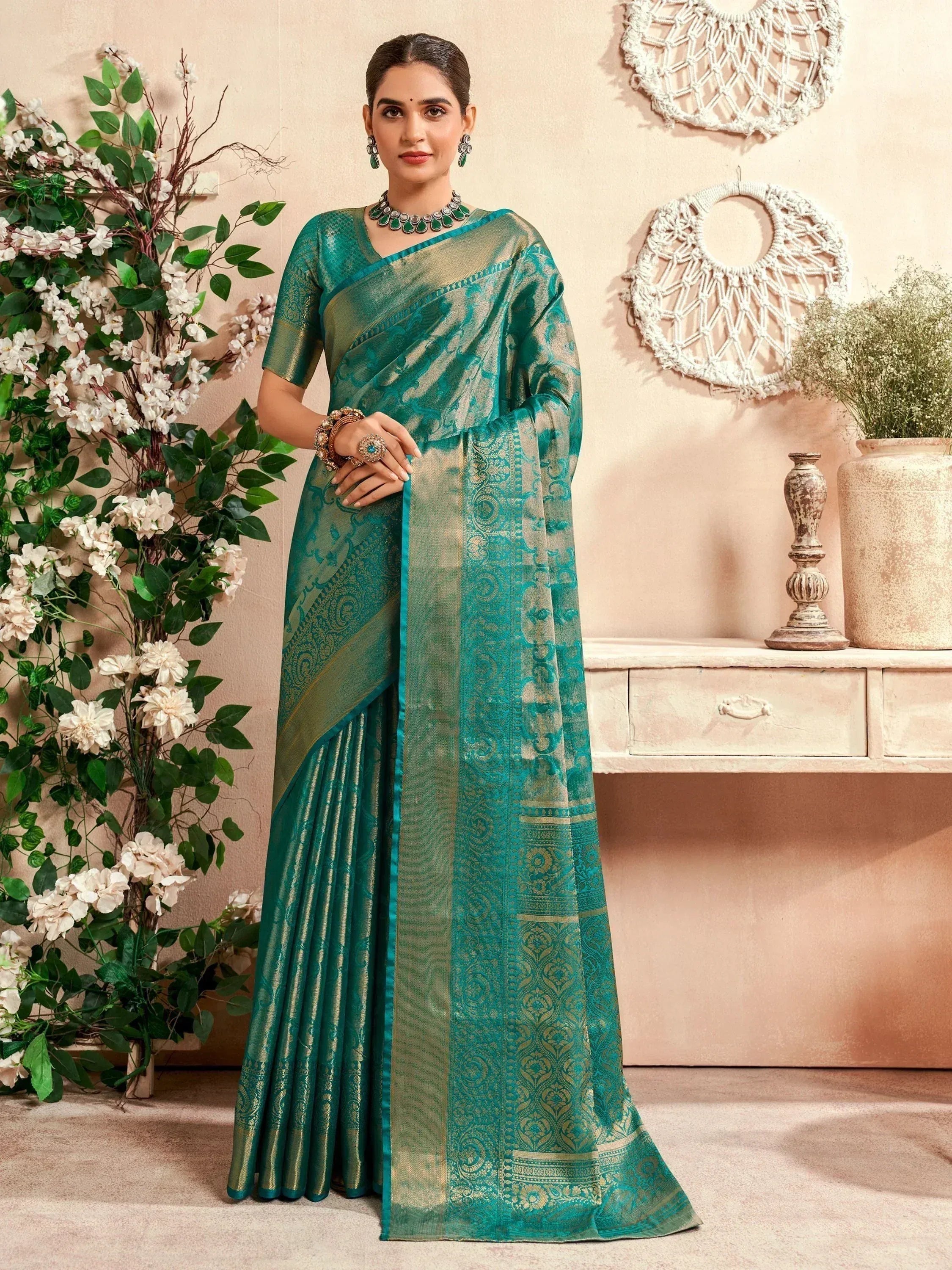 Teal green designer saree with gold zari work, perfect for Indian ethnic wear occasions