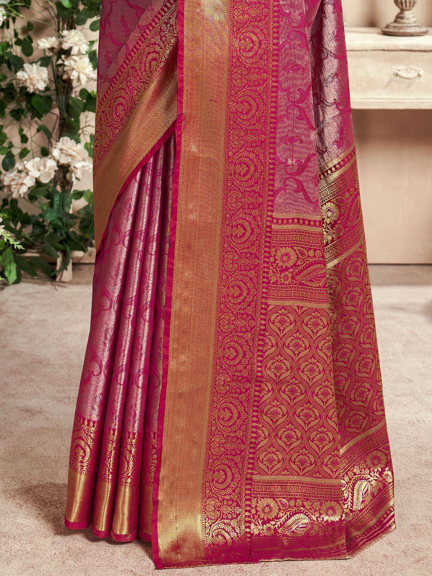 Pink and gold designer saree with intricate floral and paisley woven patterns, perfect for ethnic occasions.