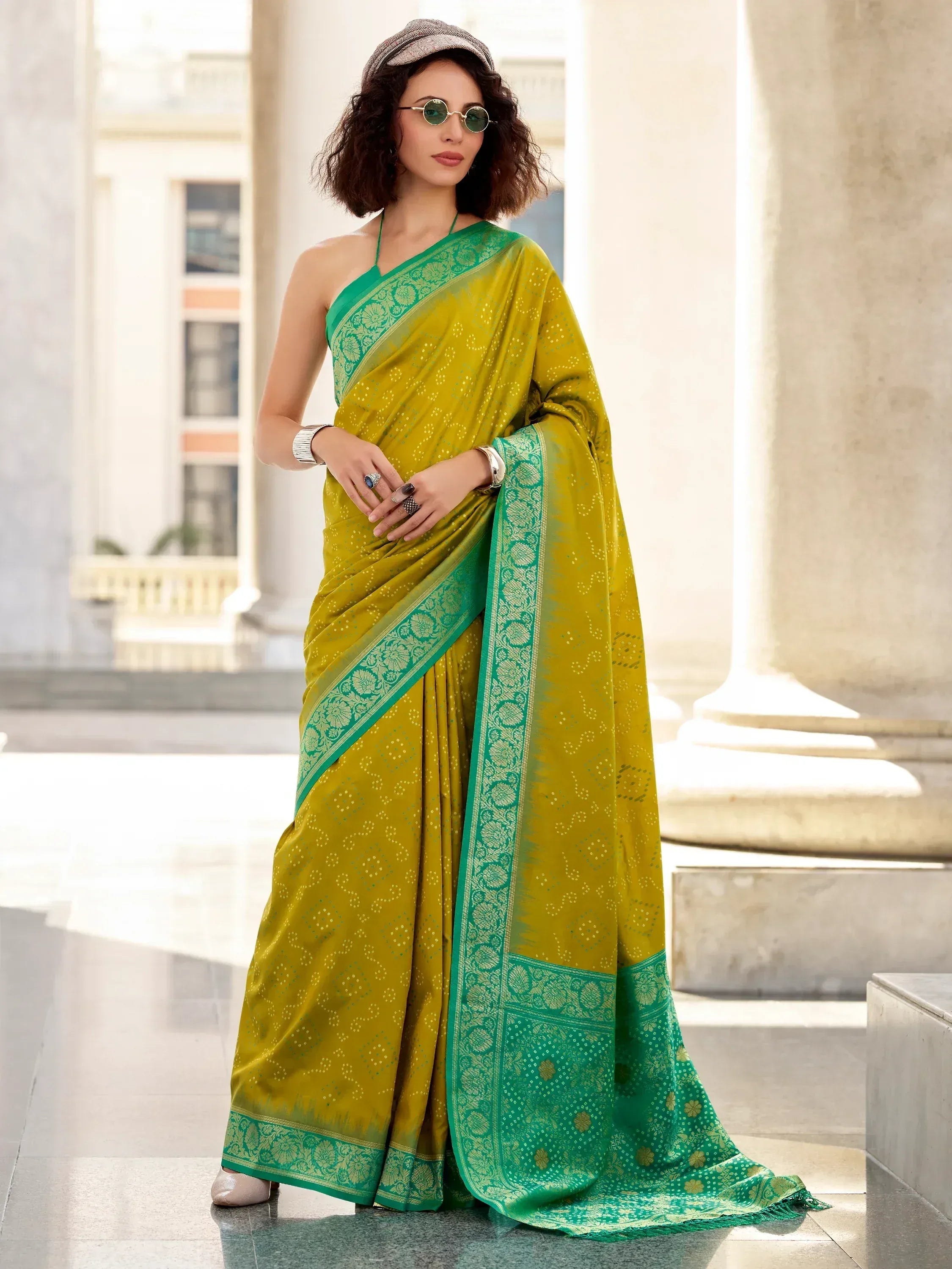 Woman in mustard yellow saree with green border, ethnic Indian wear, stylish designer saree