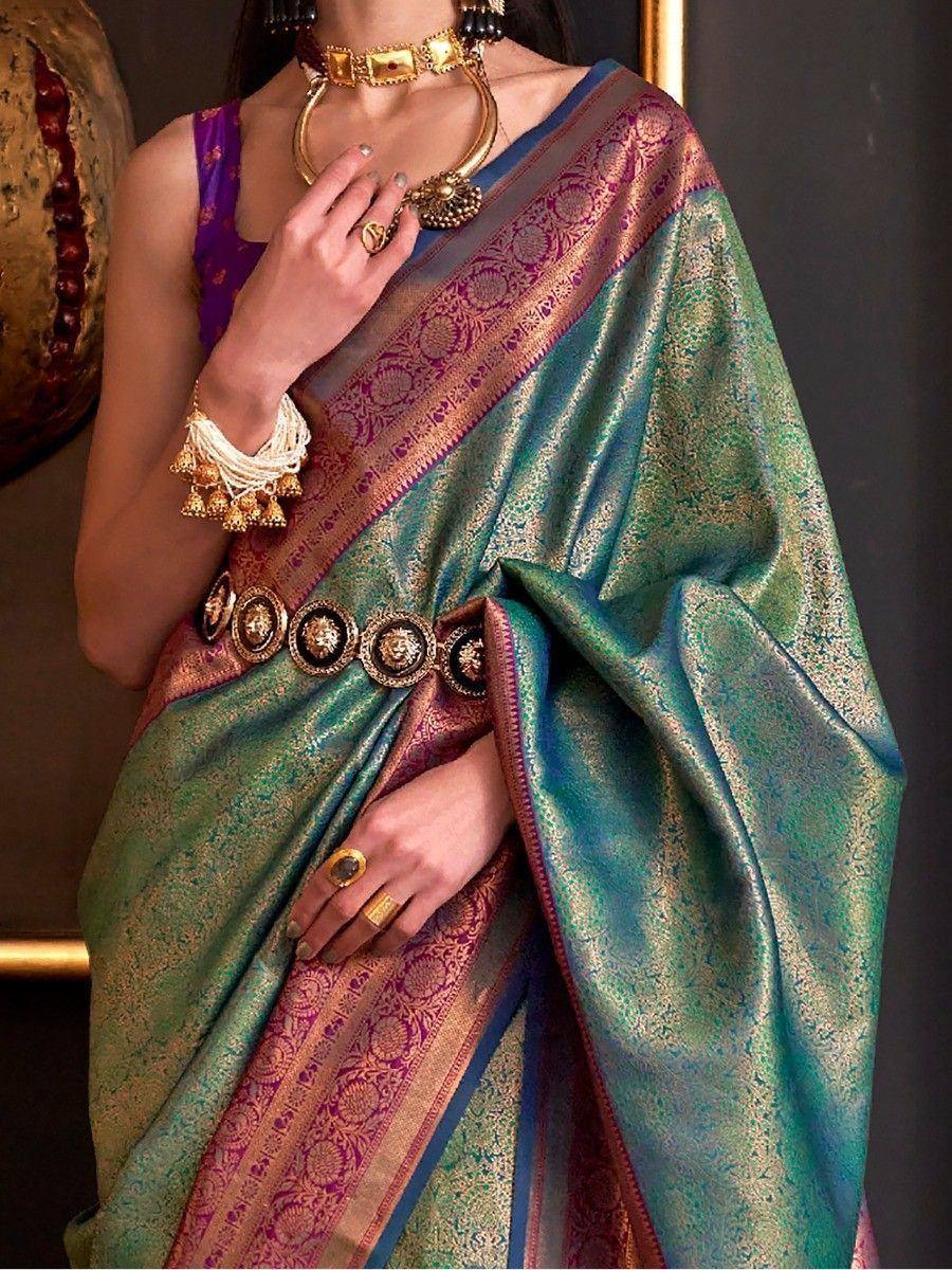 Elegant green and purple designer saree with gold embroidery, paired with traditional jewelry for ethnic wear