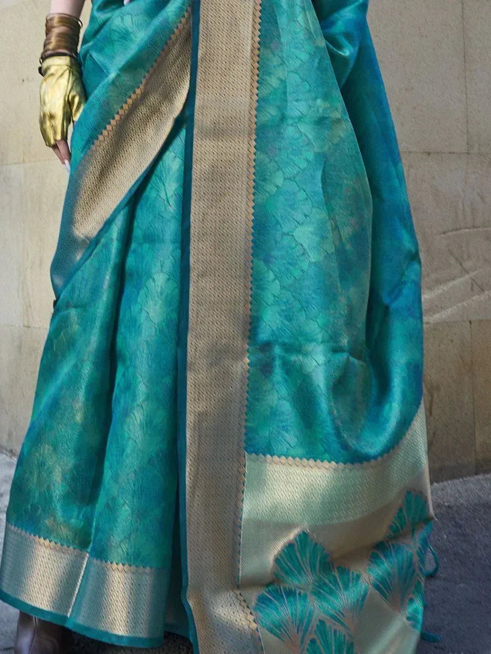 Teal silk saree with gold border and leaf motifs, Indian ethnic wear