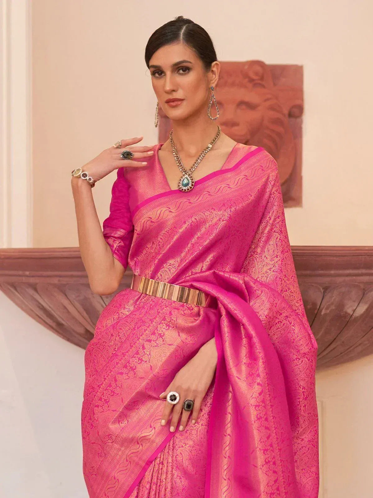 Vibrant pink designer saree with gold zari work, perfect for Indian ethnic wear occasions