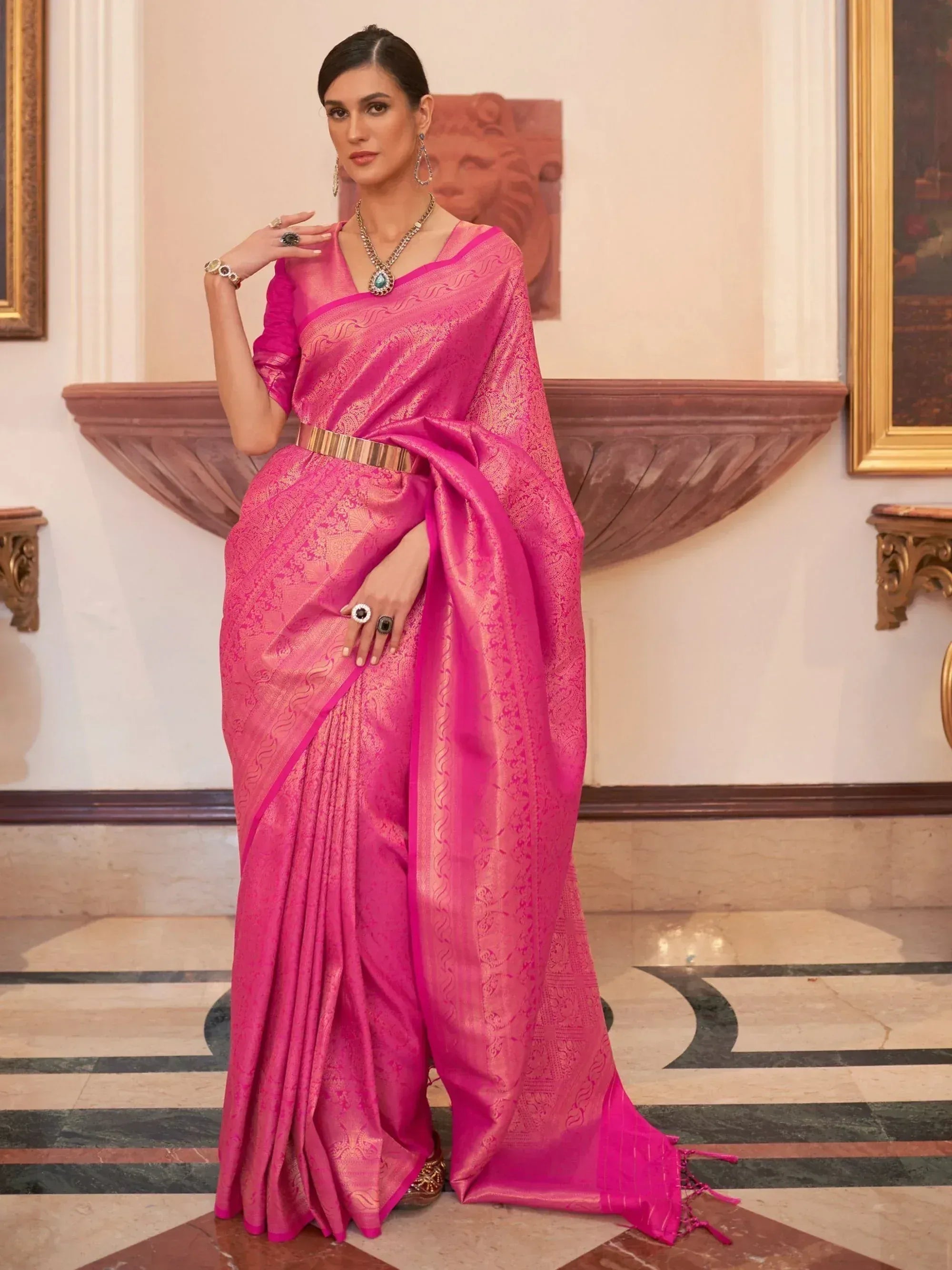 Vibrant pink designer saree with gold zari work, perfect for Indian ethnic wear occasions