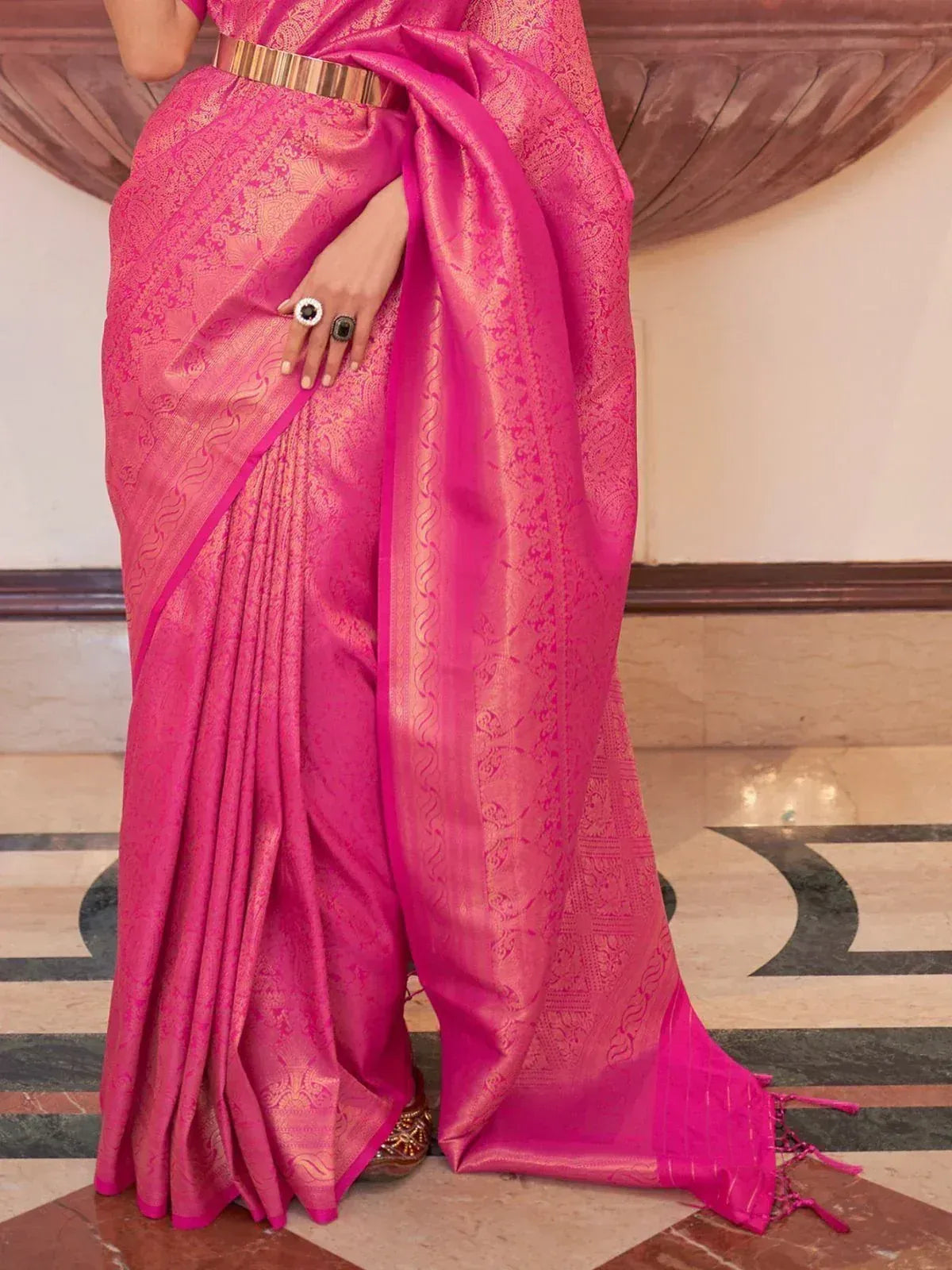 Vibrant pink designer saree with gold zari work, perfect for Indian ethnic wear occasions