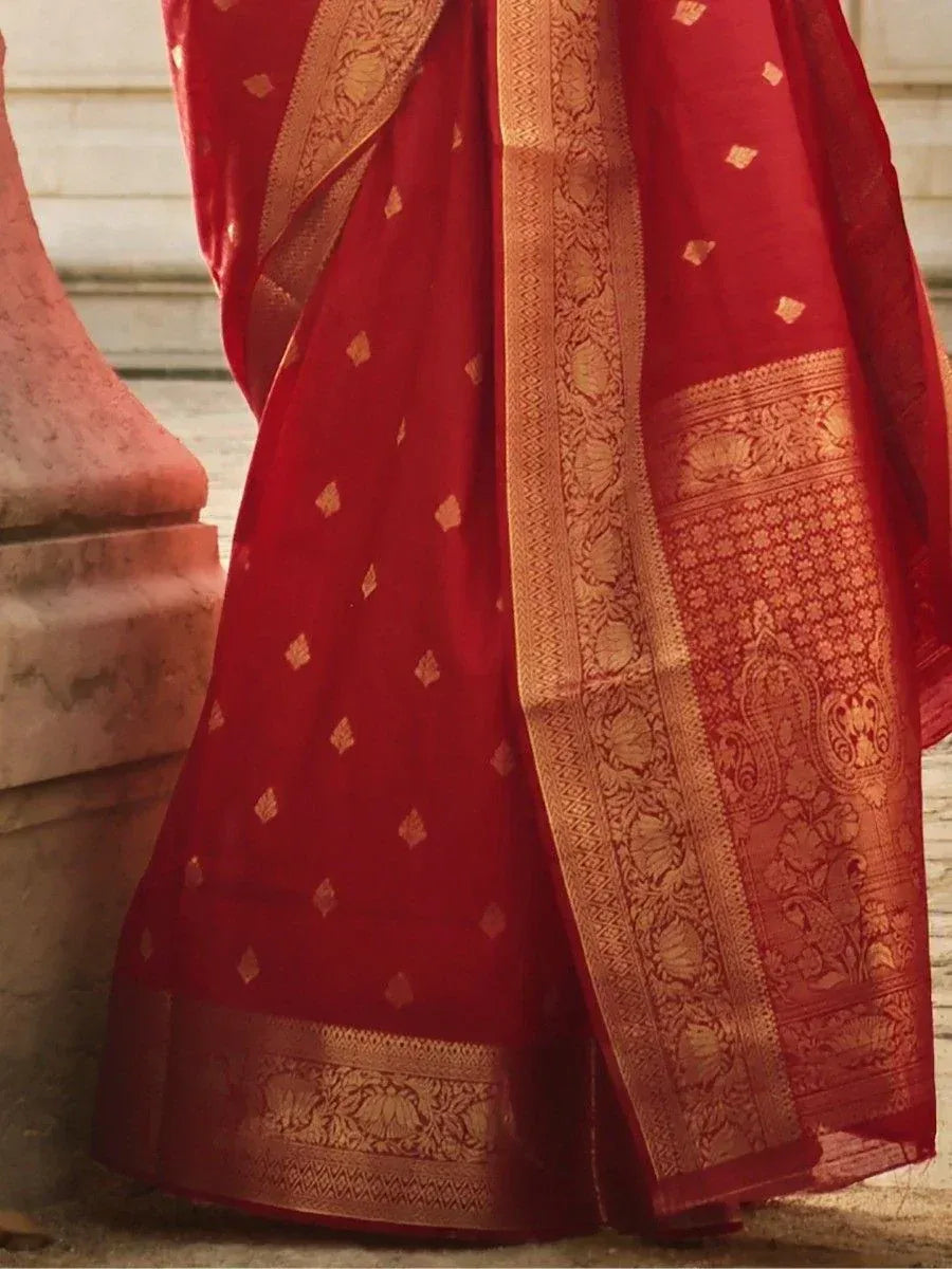 Red ethnic saree with gold floral border and woven motifs, ideal for Indian occasions