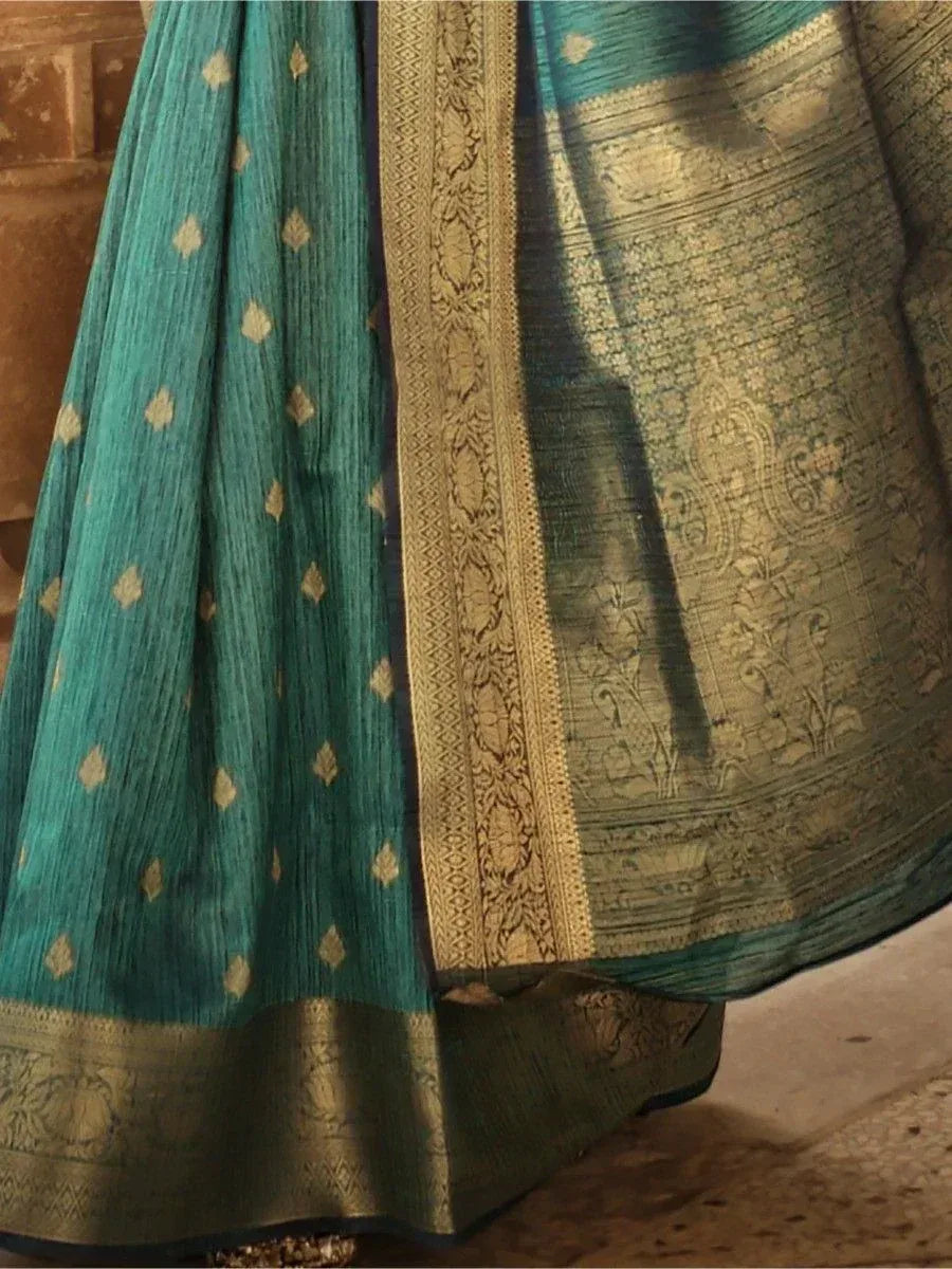 Teal ethnic saree with gold zari border and floral motifs, traditional Indian wear
