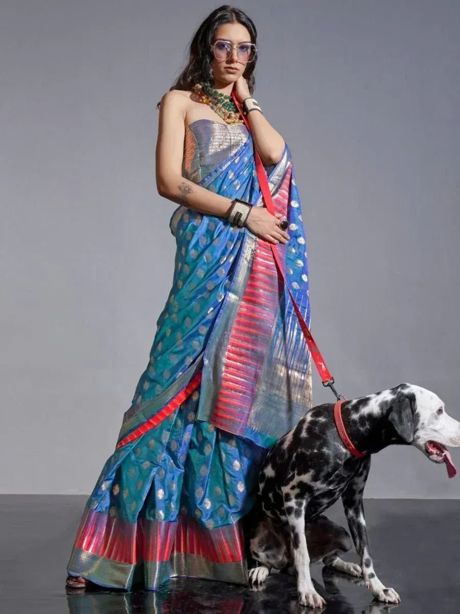 Woman in blue and pink designer saree with dog, ethnic wear fashion