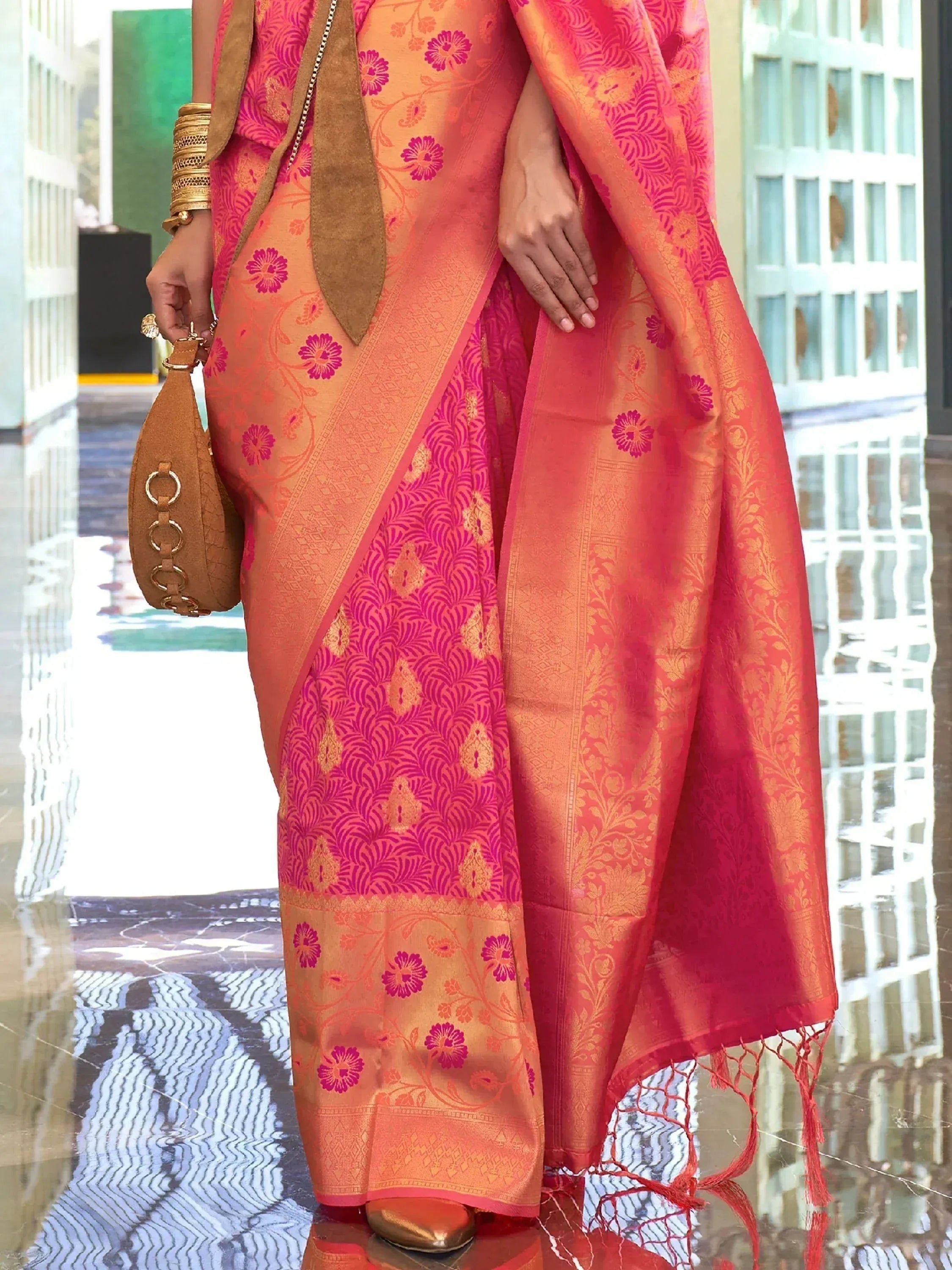 Vibrant pink and orange floral saree with gold zari, perfect for Indian ethnic occasions