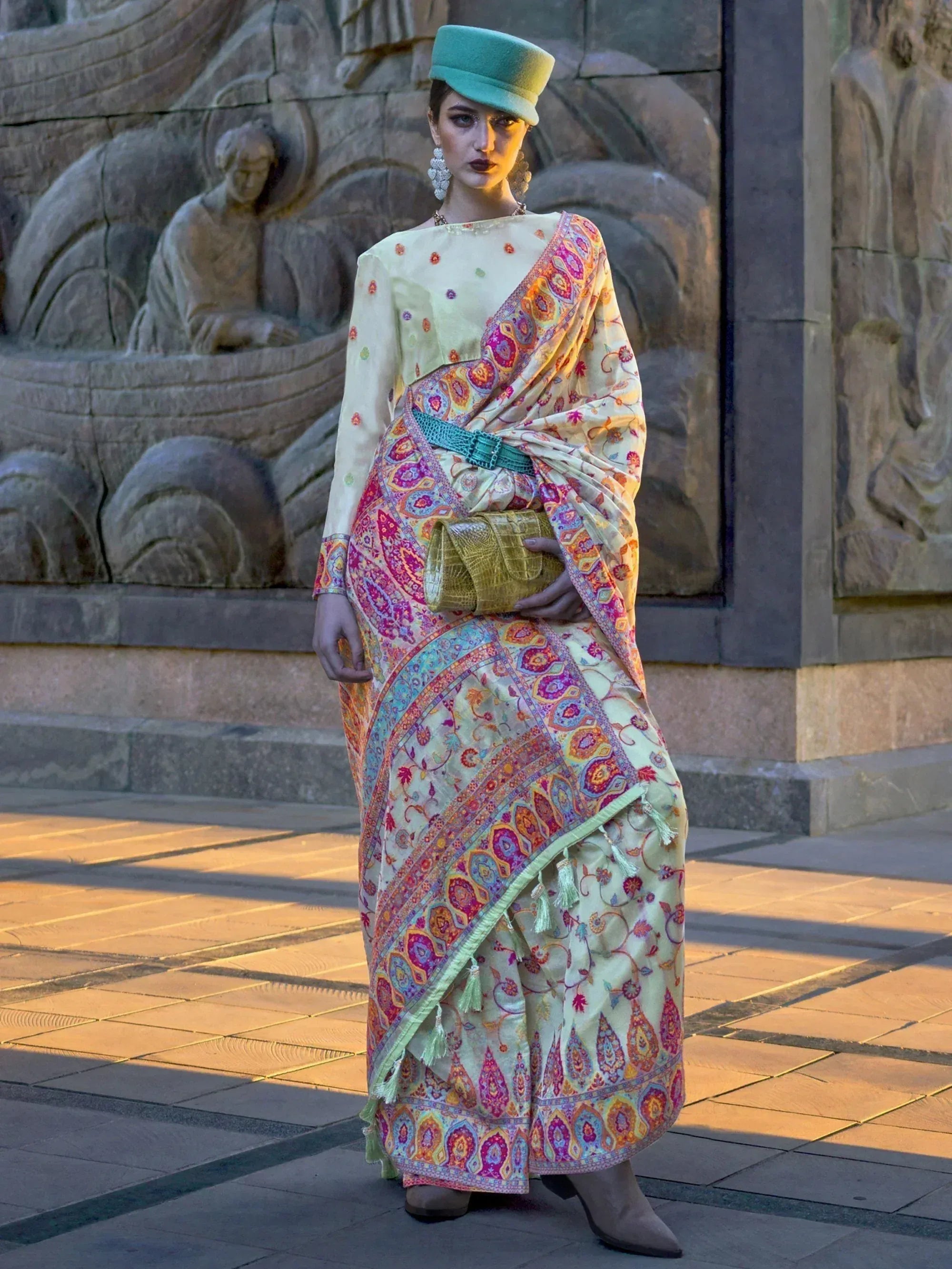 Woman in colorful printed saree with green hat, ethnic wear for festive occasions