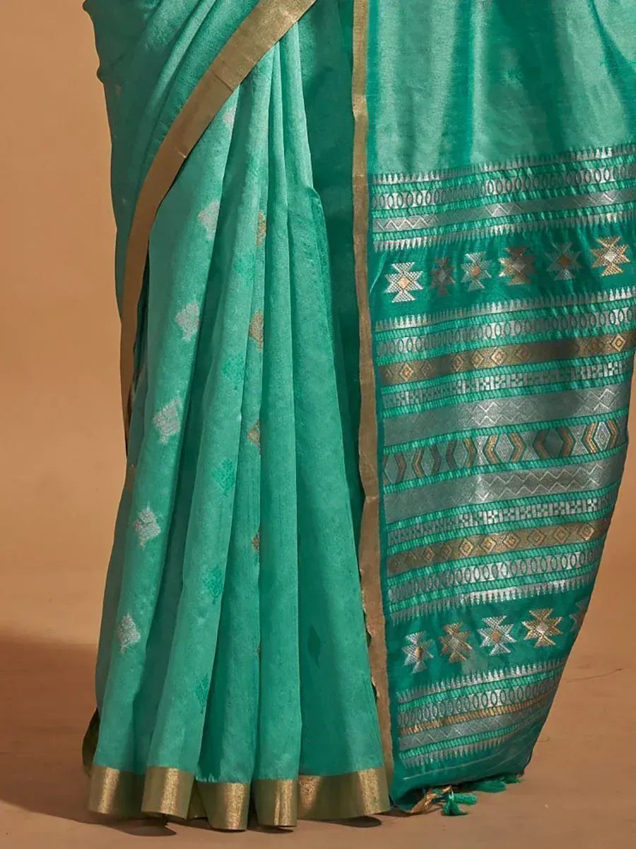 Teal green ethnic saree with gold and silver geometric border, perfect for Indian occasions