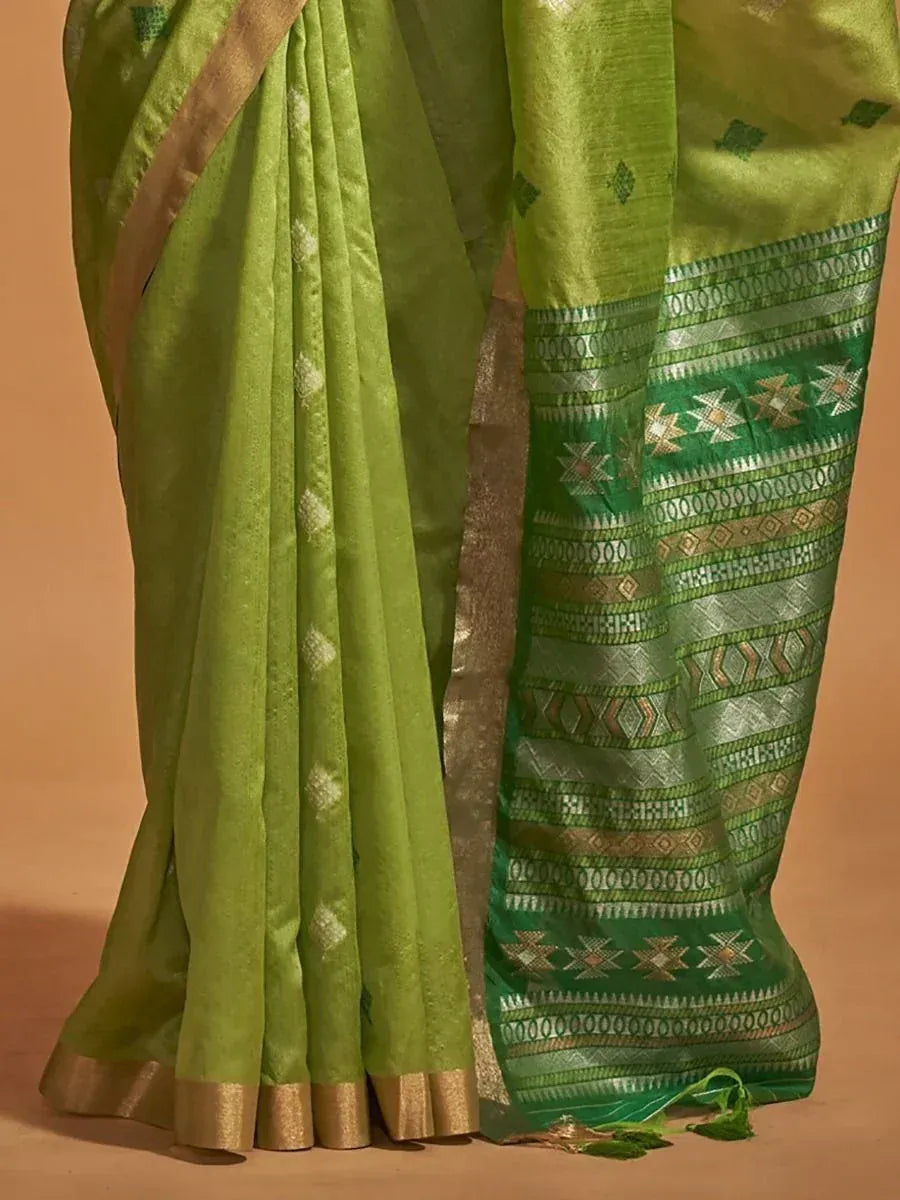 Green designer saree with intricate geometric border, perfect for ethnic occasions