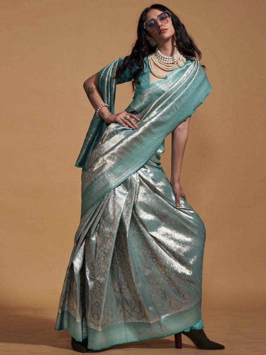 Teal designer saree with gold zari work, perfect for ethnic occasions and Indian weddings