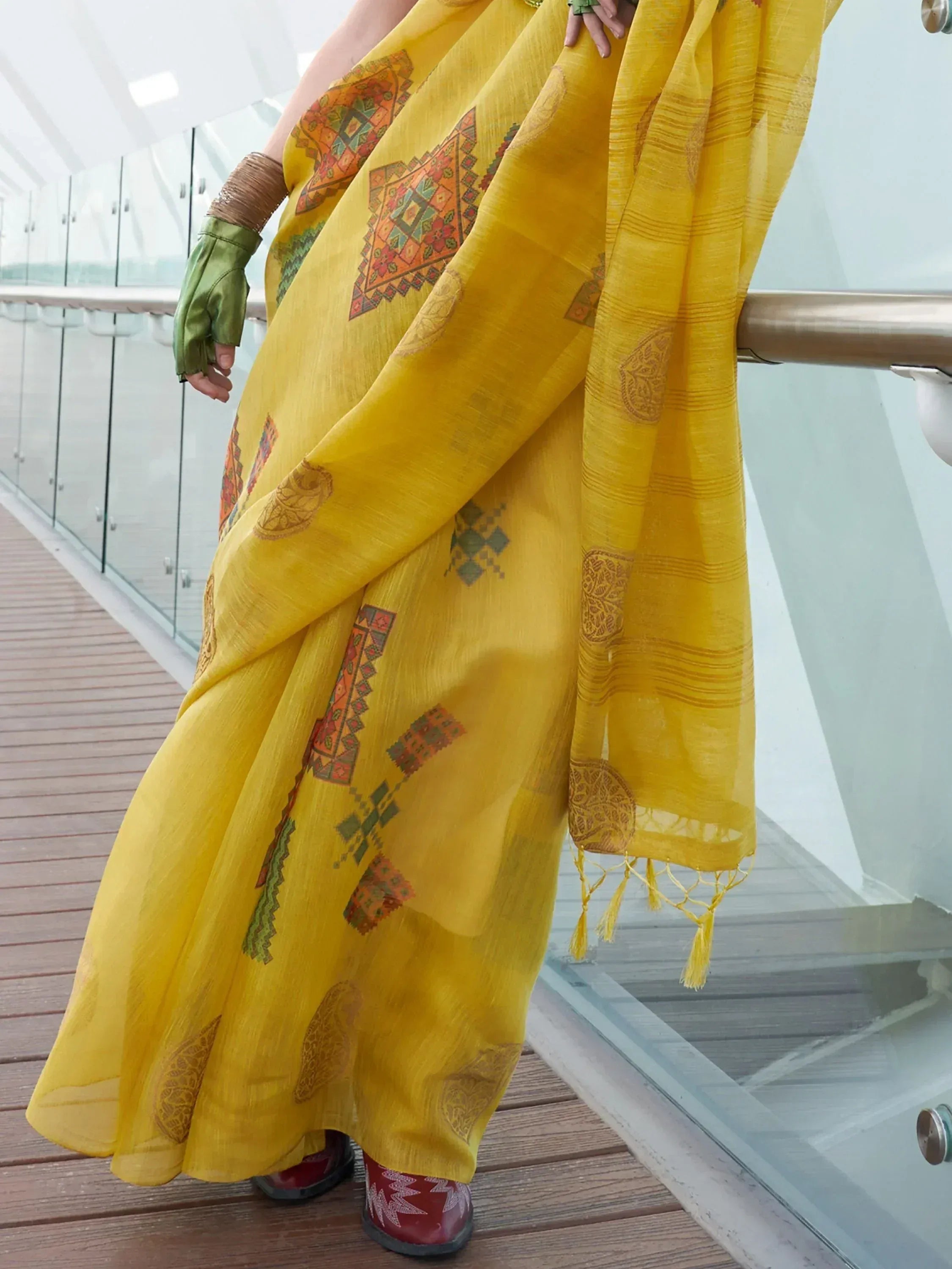 Vibrant yellow ethnic saree with geometric prints, perfect for Indian festive wear and designer occasions.