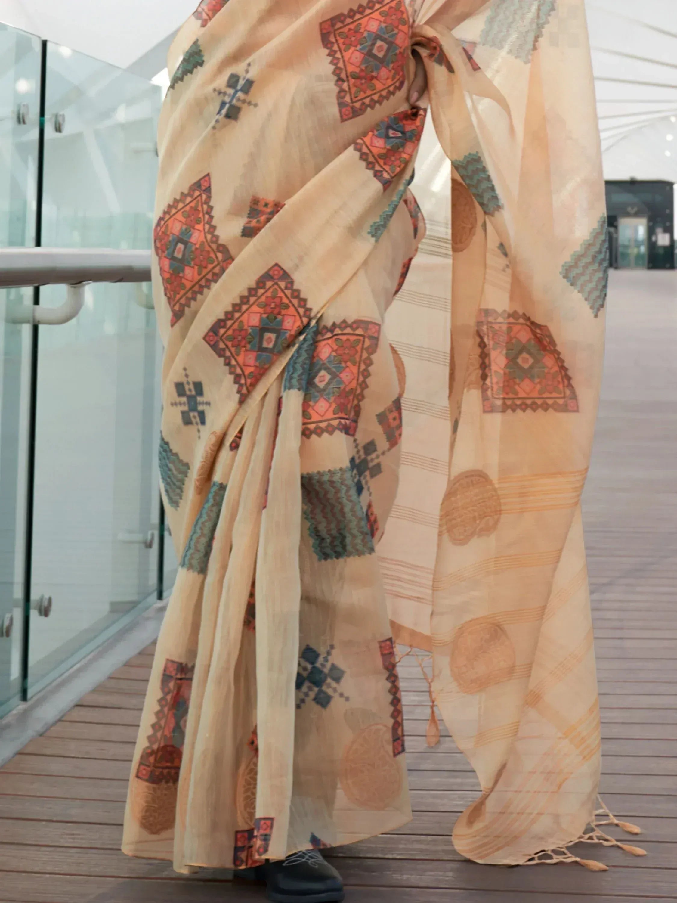 Beige ethnic saree with geometric prints, perfect for Indian traditional wear and festive occasions.