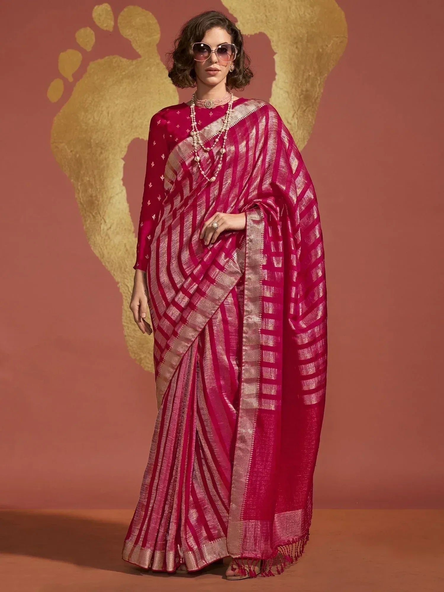 Fuchsia ethnic saree with gold stripes, perfect for Indian occasions and festive wear.
