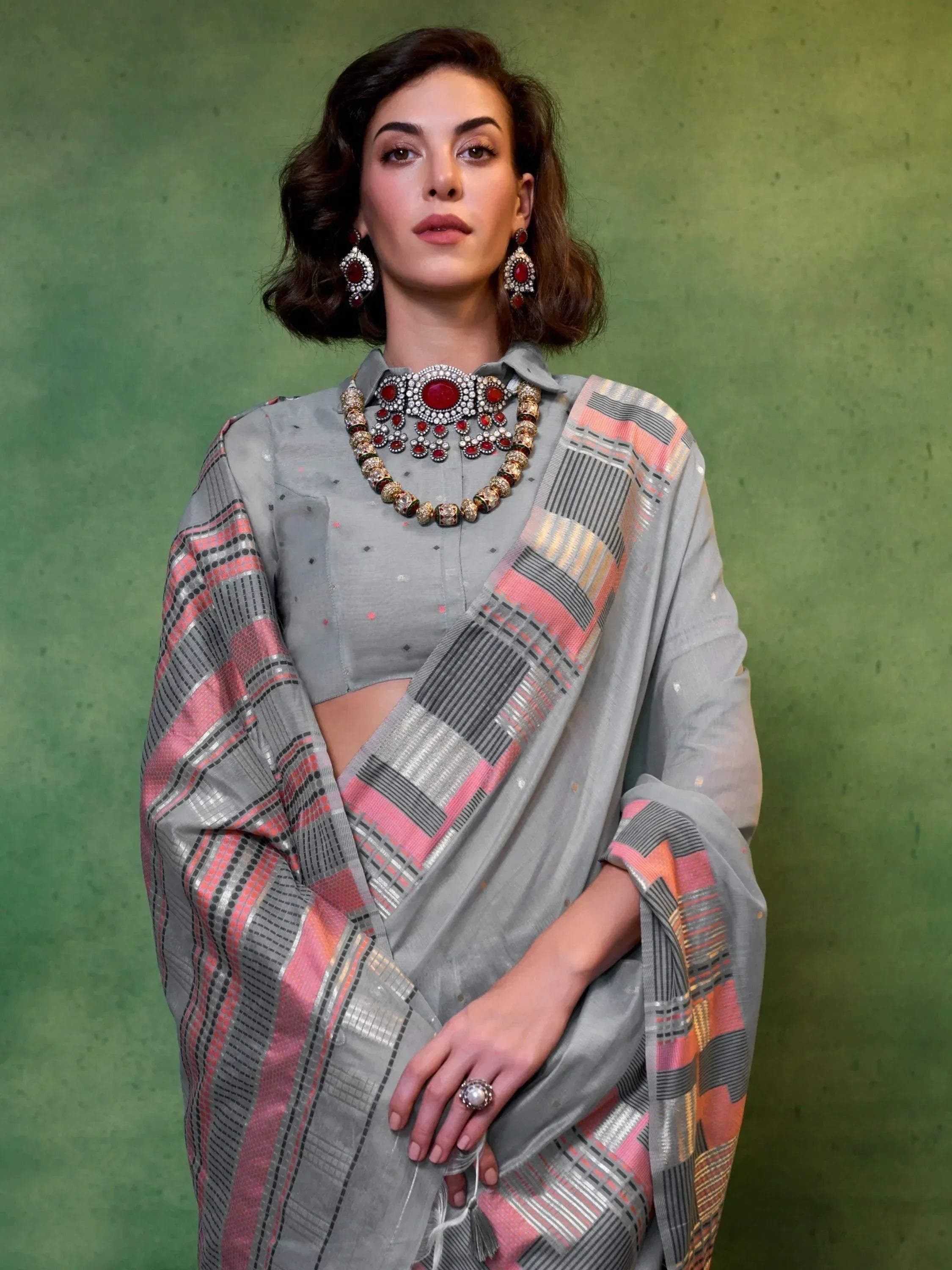 Grey ethnic saree with pink and silver checks, paired with statement jewelry for Indian wear