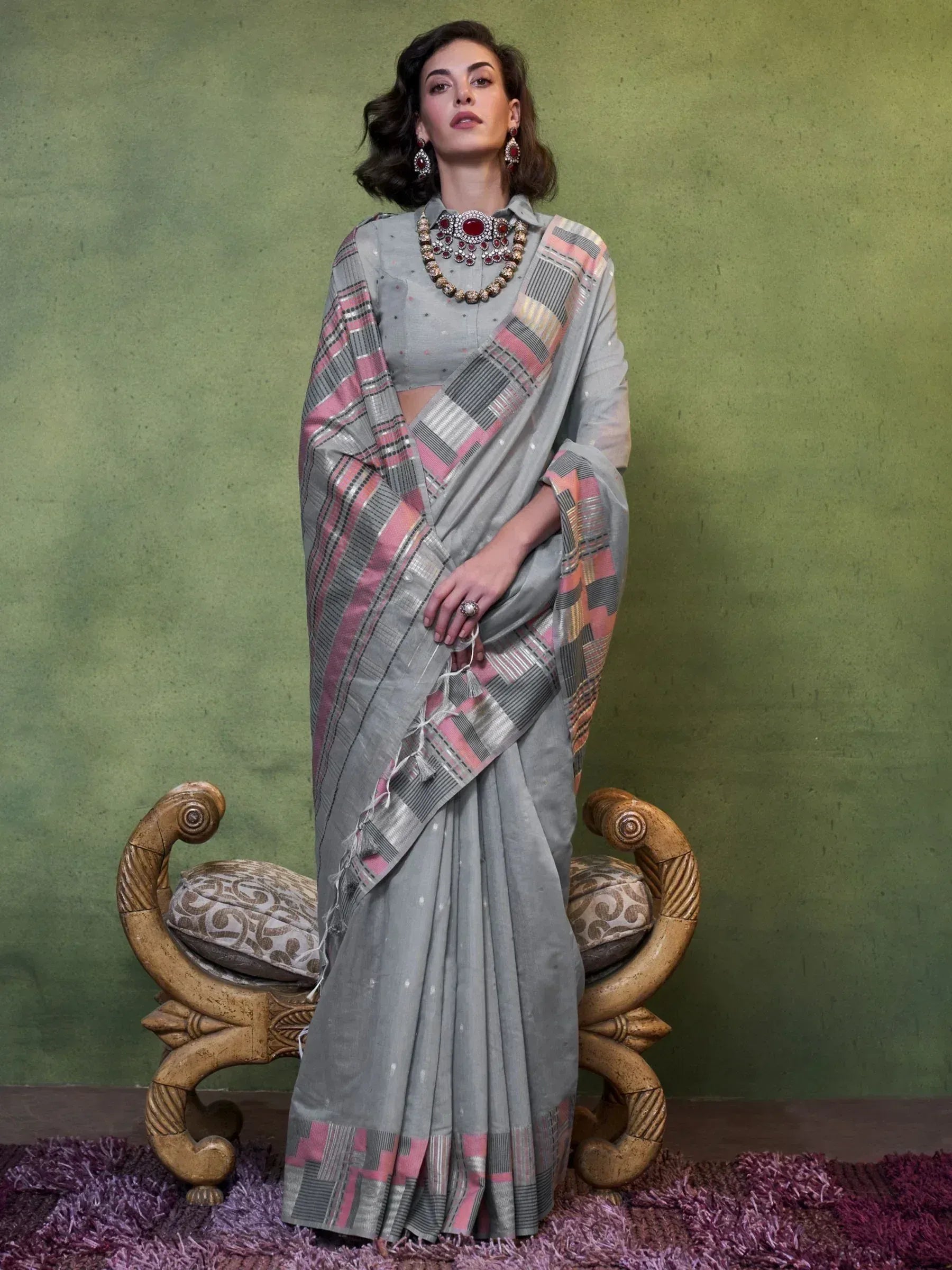 Grey and pink plaid saree with matching blouse, styled with traditional jewelry for ethnic wear