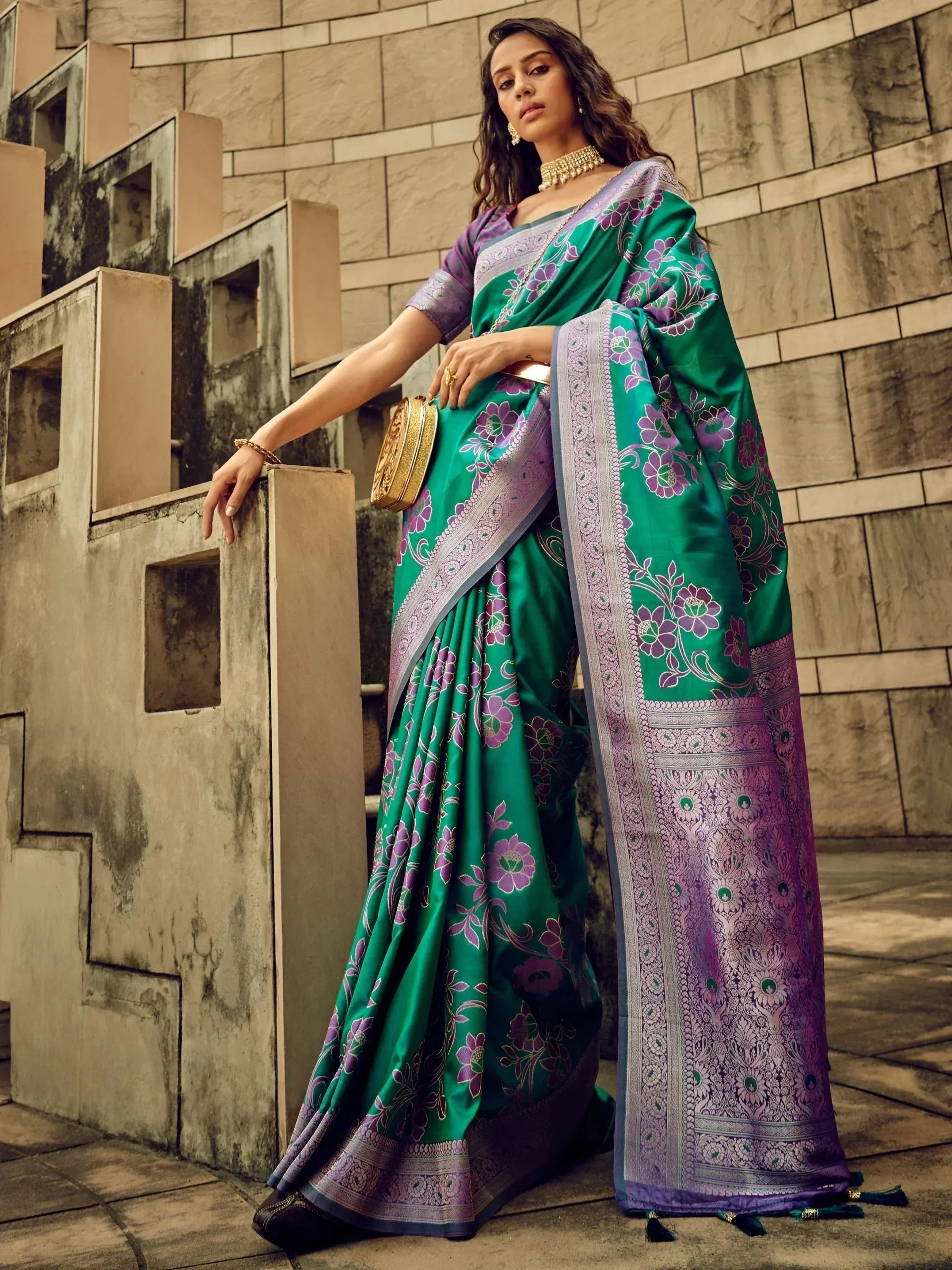 Green and purple floral designer saree with intricate border, perfect for ethnic occasions