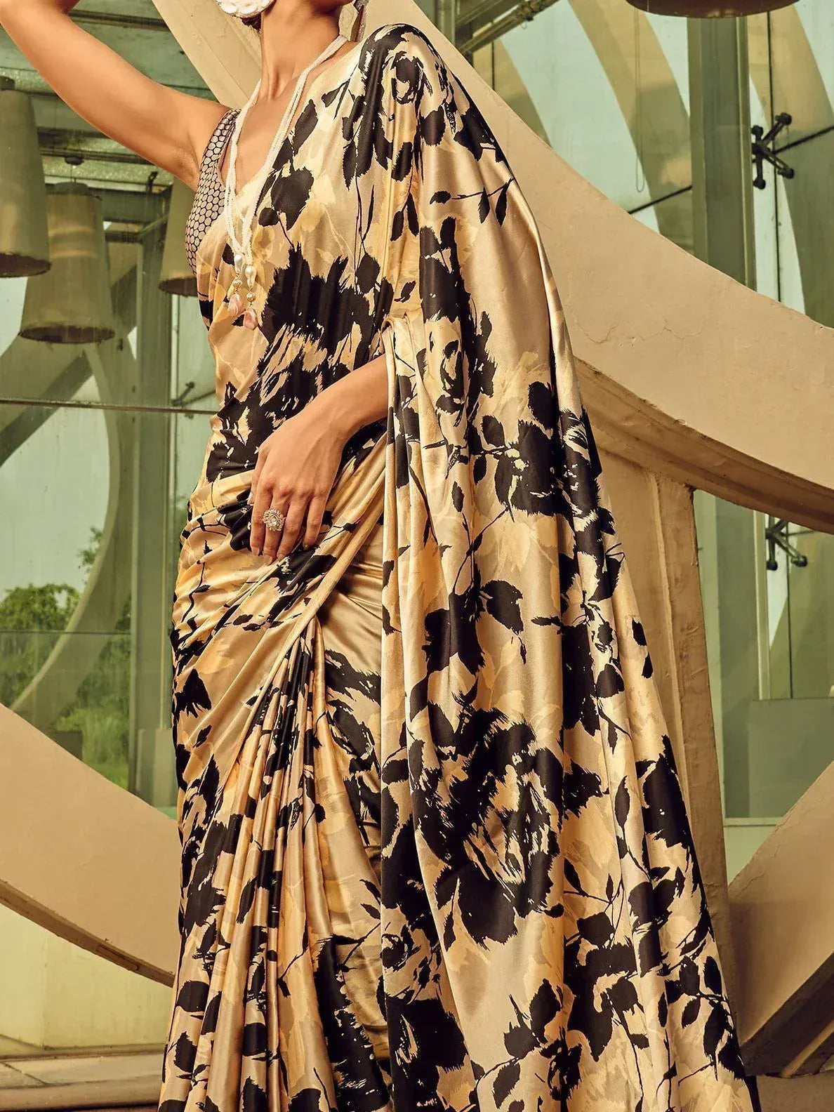 Elegant gold and black floral print saree with designer blouse, perfect for Indian ethnic occasions.