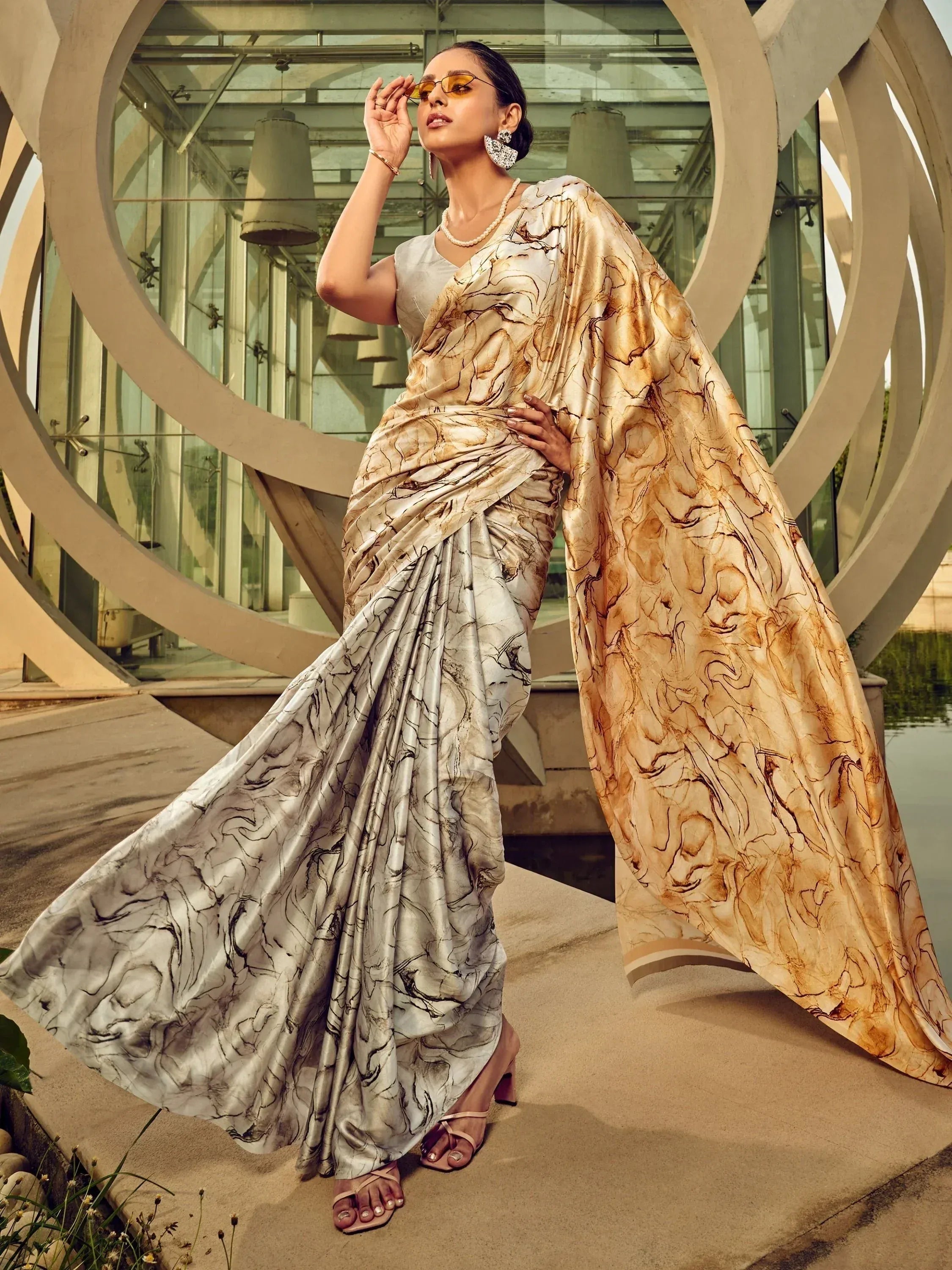Woman in elegant marble print saree with modern blouse, stylish ethnic wear for women