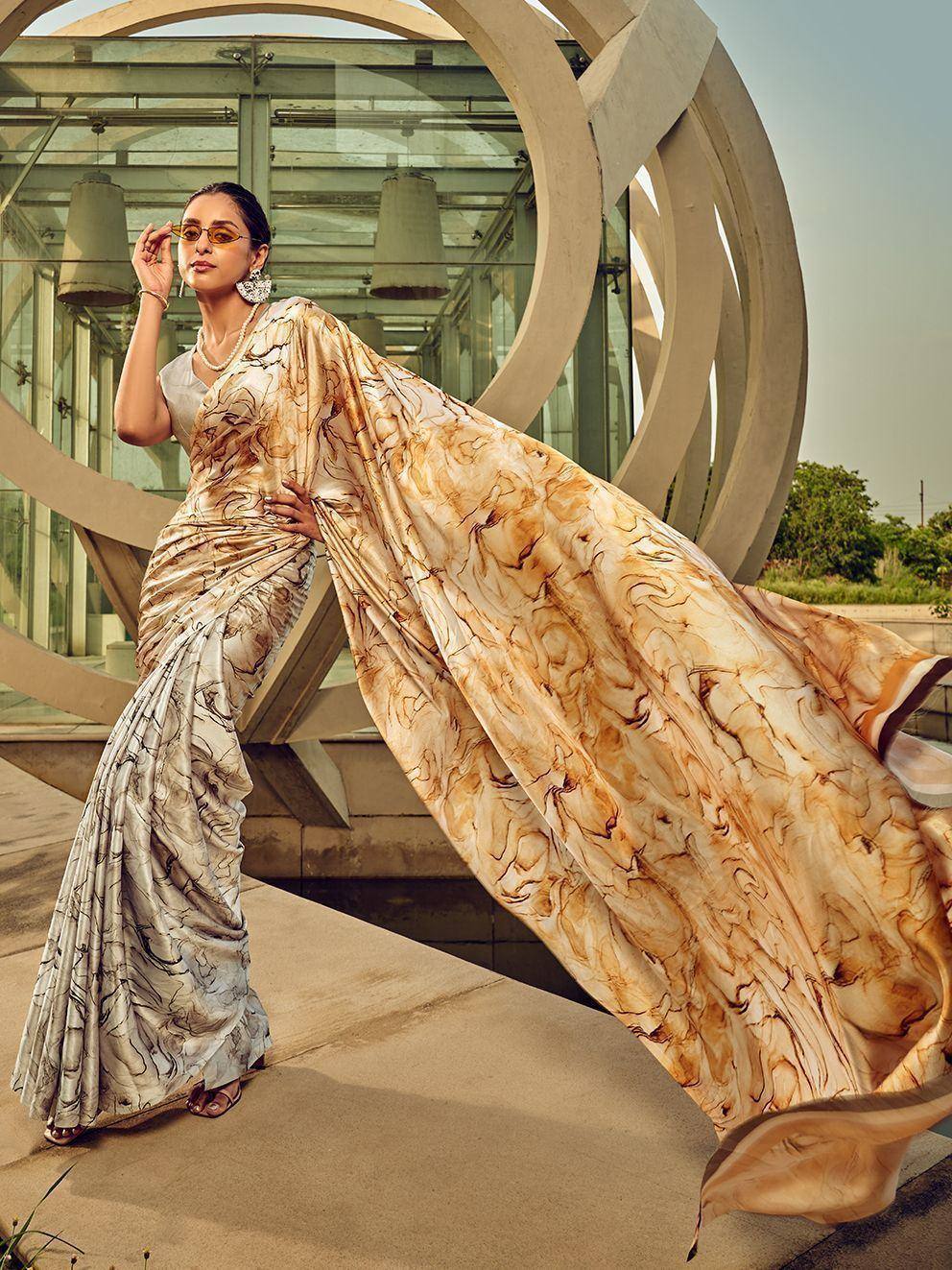 Woman in elegant marbled saree with flowing drape, styled for modern ethnic wear